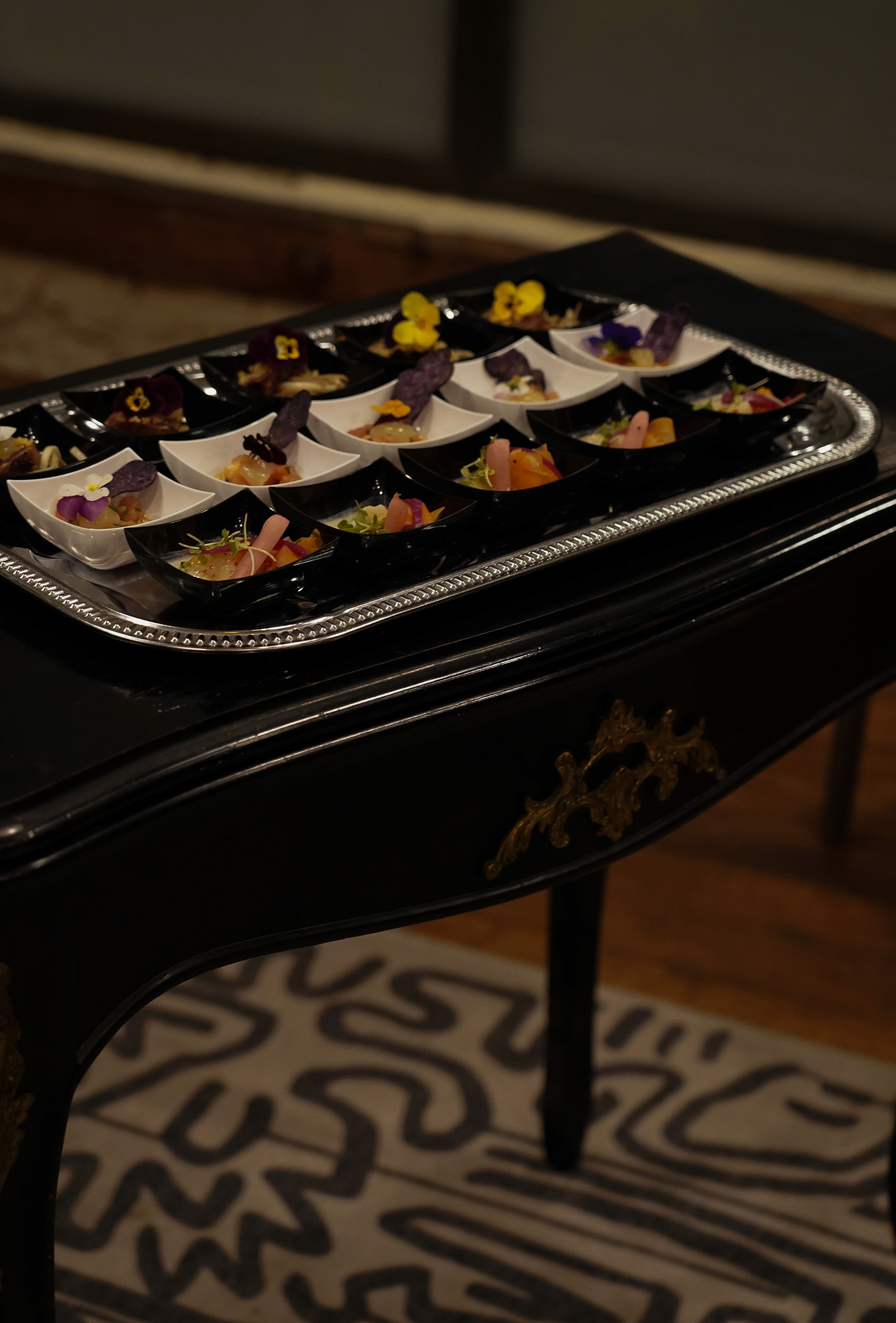 Metal Table standing aganst a wood wall