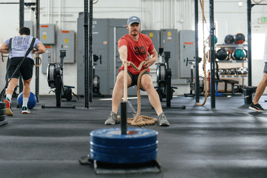 Athletes doing sled pull during HYROX class at Koda CrossFit Iron View