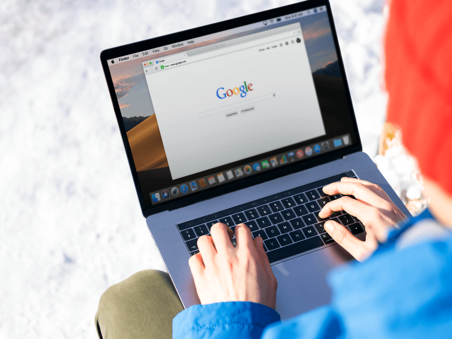 person using a laptop searching on Google