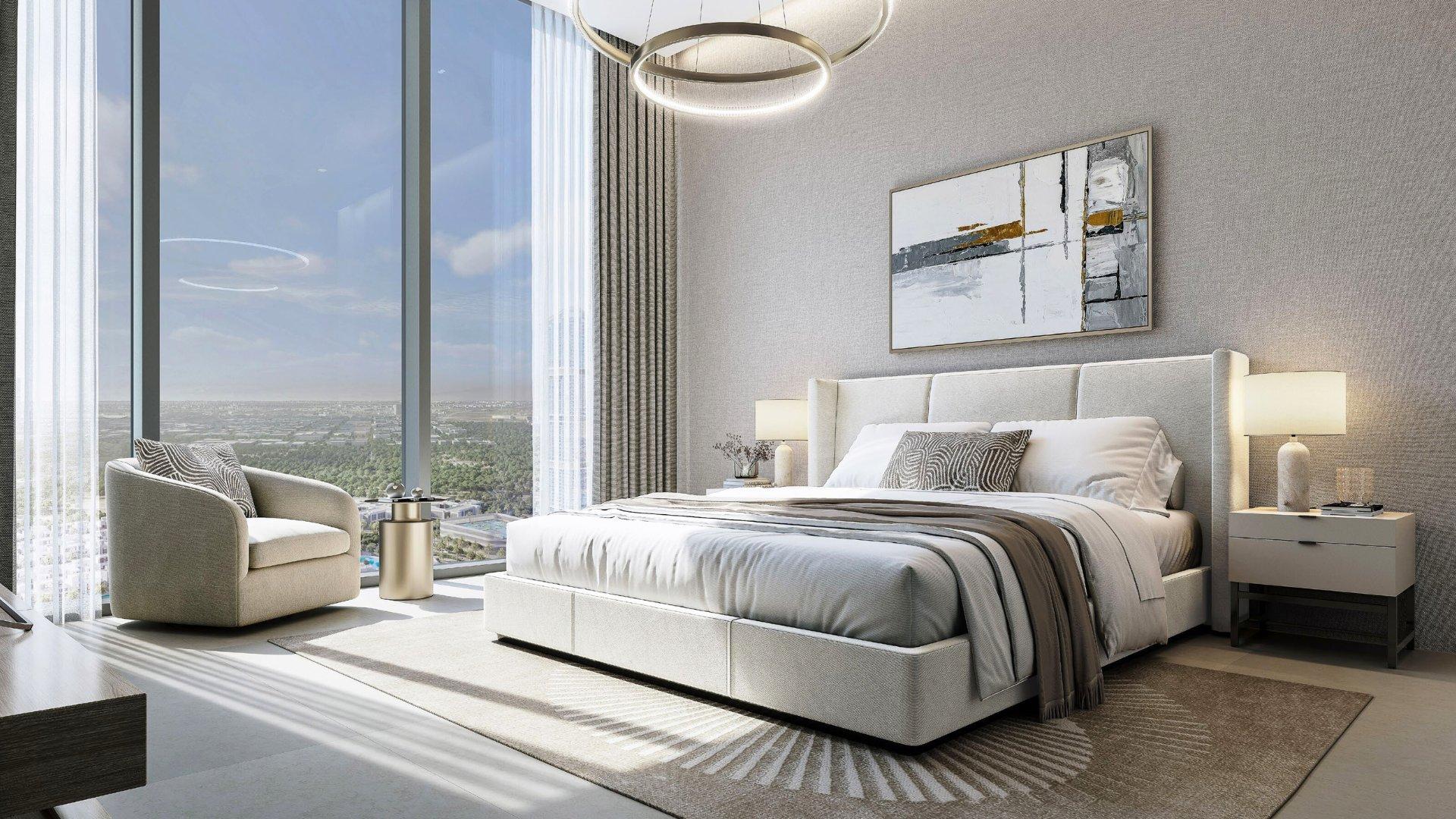 A stylish bedroom featuring a large window with a panoramic view of the city skyline at Skyvue Altier.