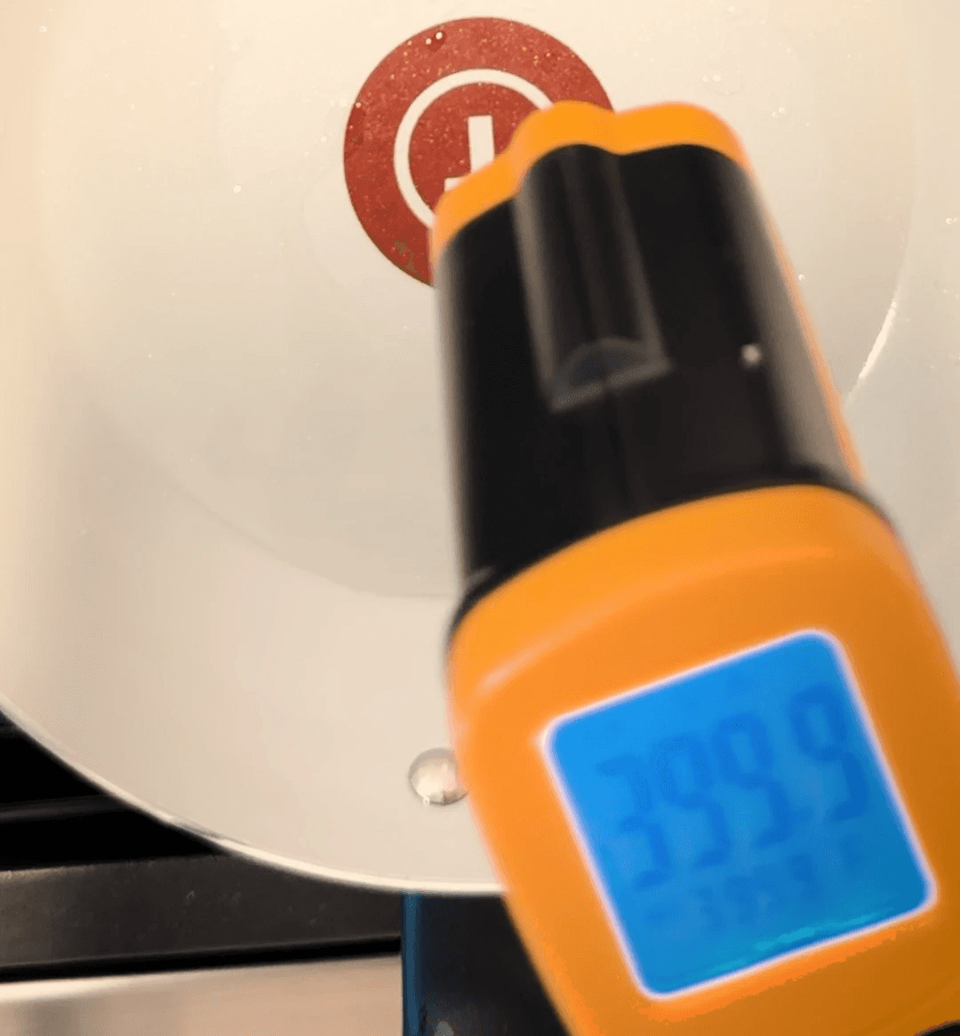 an infrared thermometer showing a temperature of 399.9 degrees farenheit