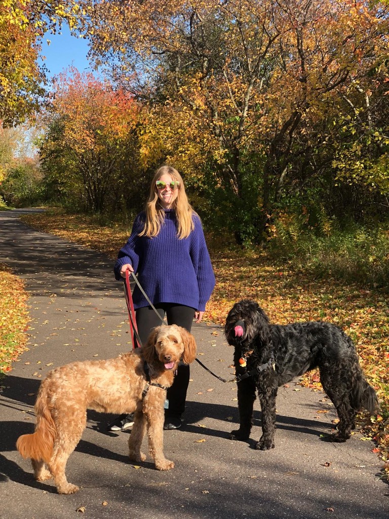 Megan professional dog walker with two dogs