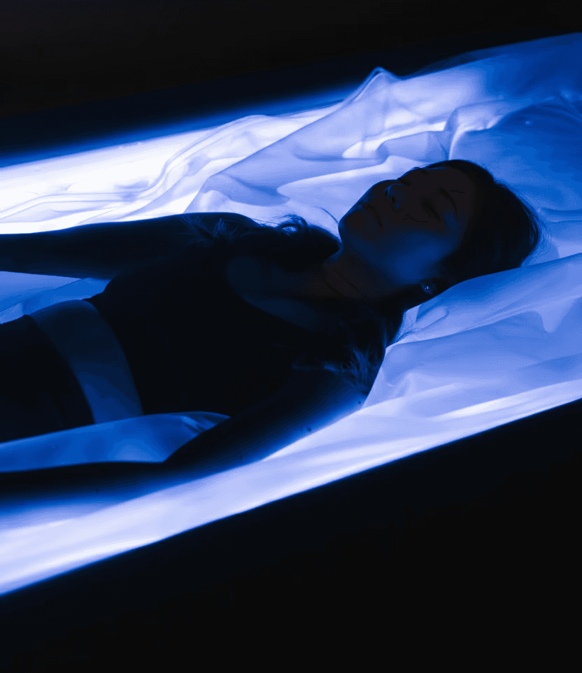 Woman doing floatation therapy on a dry floatation bed