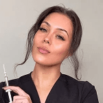 woman with pink and white floral face paint