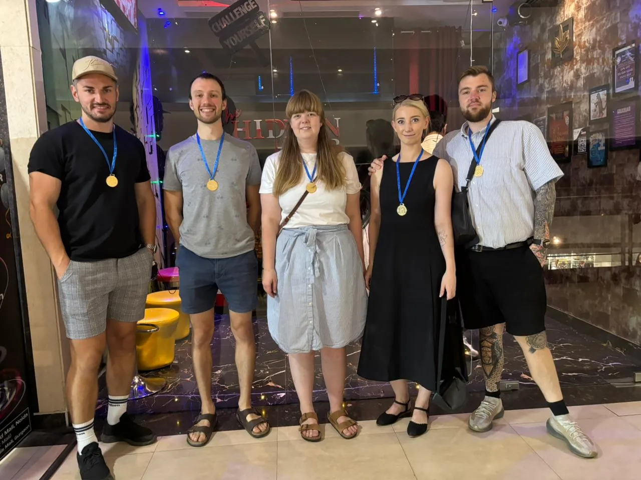 Kids and parents posing for a testimonial after a birthday party in Noida