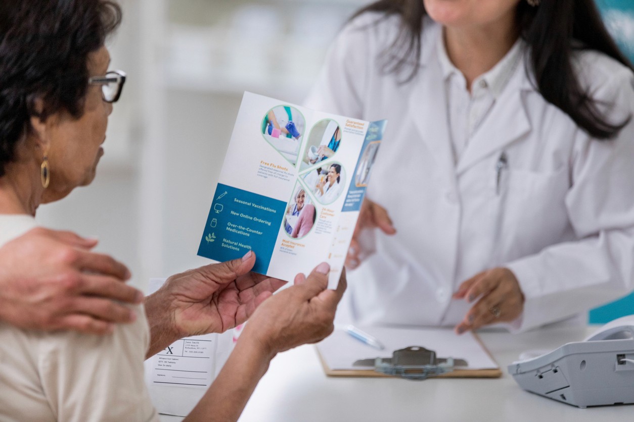 Senior woman reviewing senior care options with doctor