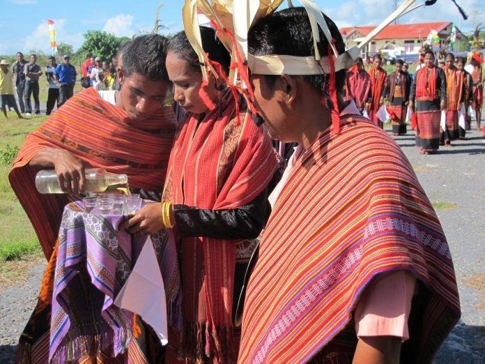 A group of people wearing traditional clothing

Description automatically generated with low confidence