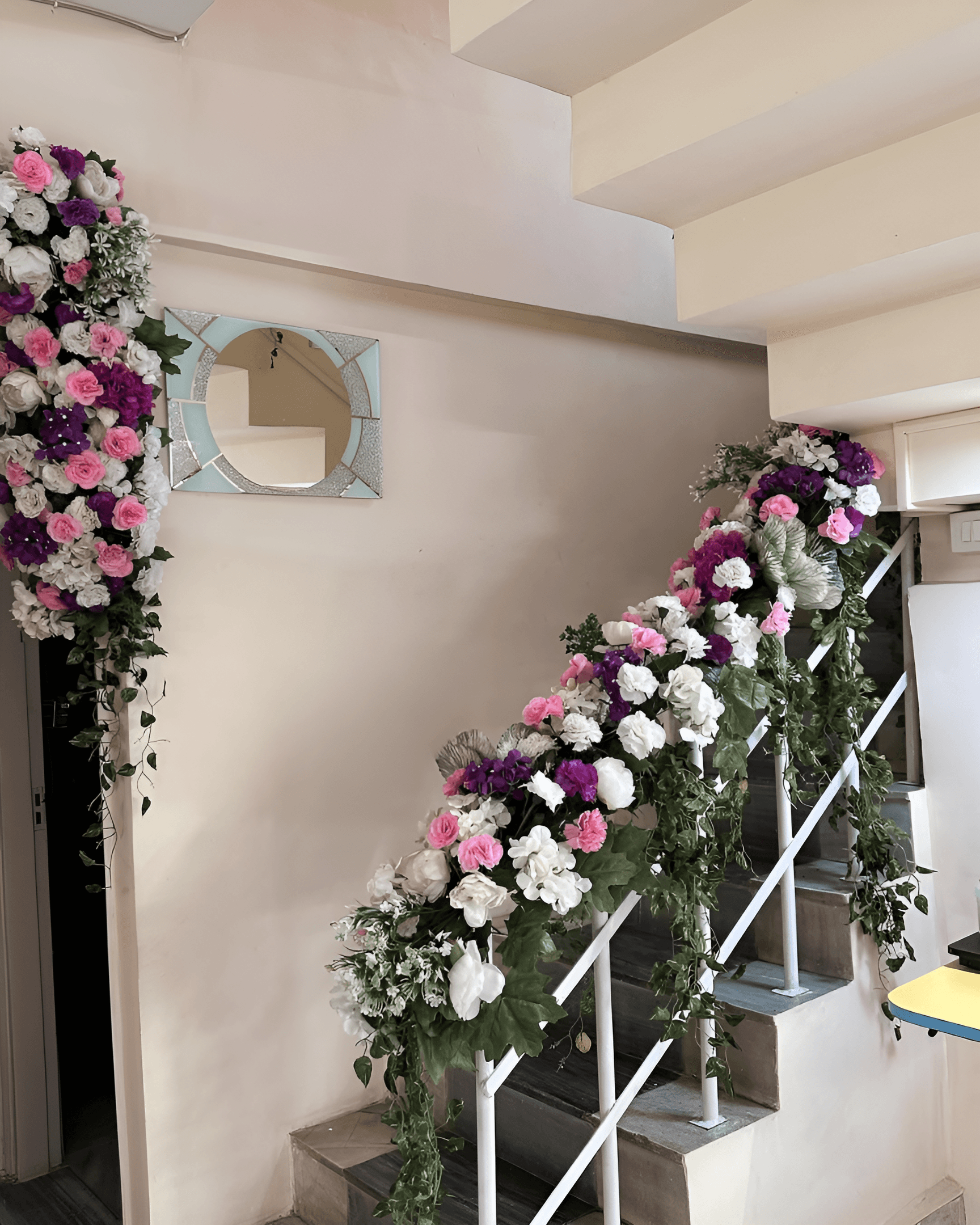 Stair decor with white, pink, & purple flowers for wedding home decoration in Keshav Puram, West Delhi, Ghaziabad, & Gurugram