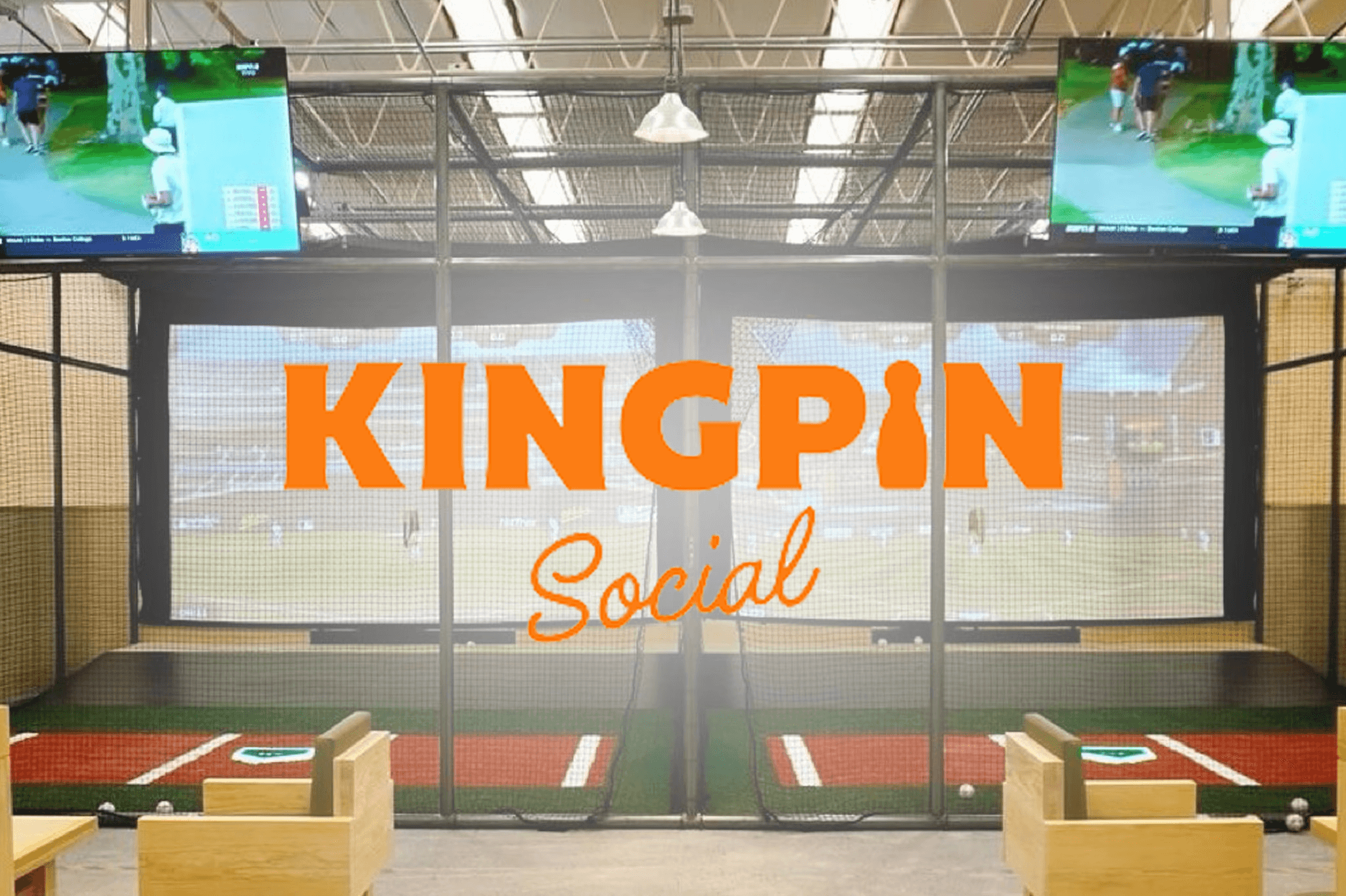 HitTrax Suite batting cage inside Kingpin Social entertainment venue with lounge seating and screens.