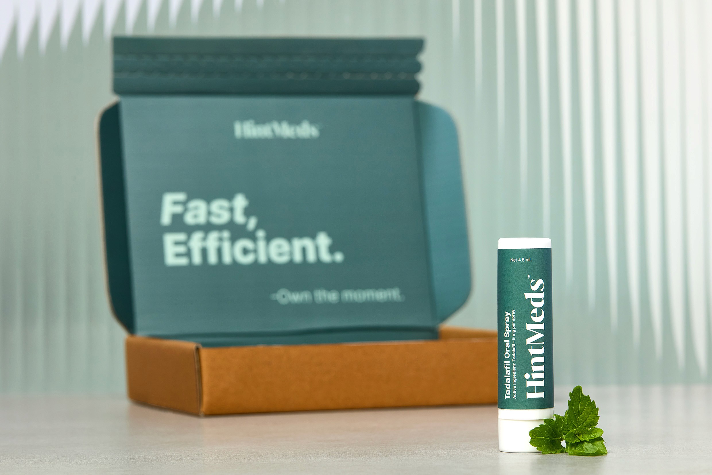 Hintmeds spray bottle in front of package