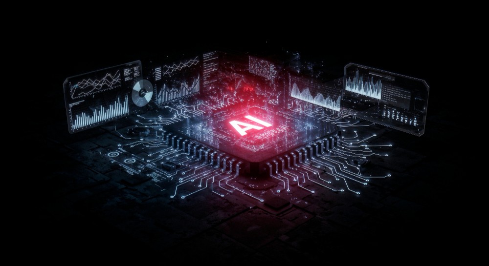 Aerial view of a winding road cutting through rocky terrain and sandy landscape.