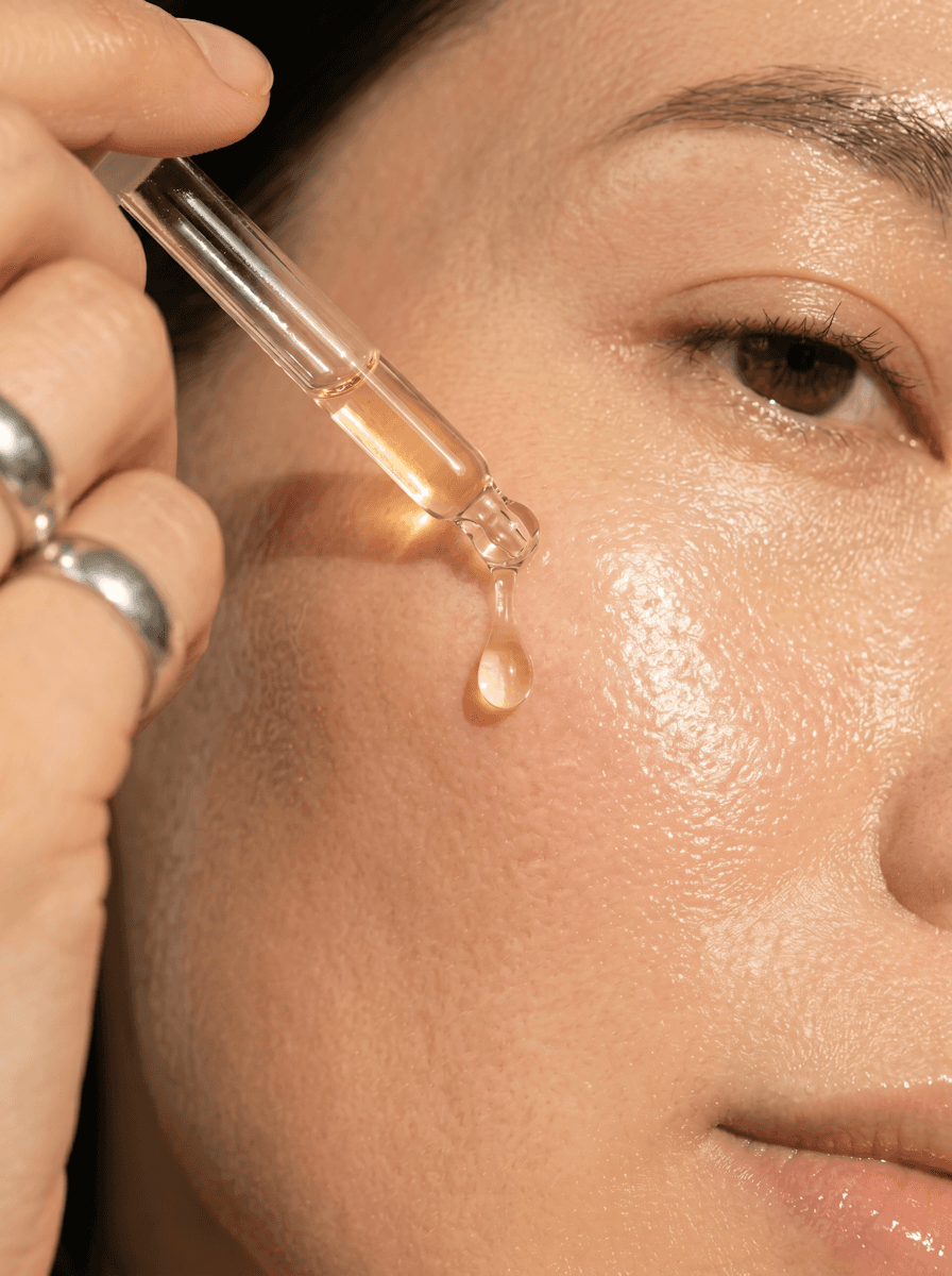 Serum drop applied to skin for glow