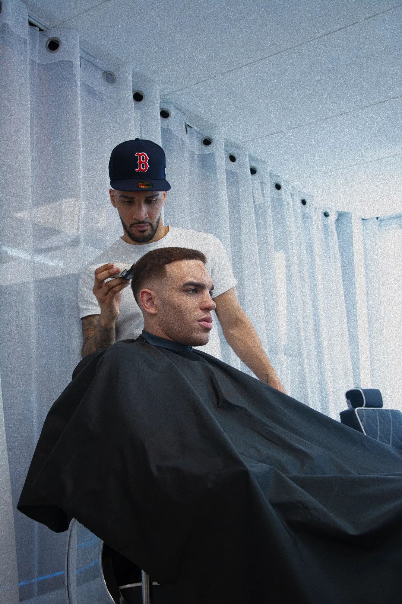 Barber Using Clippers on a Client