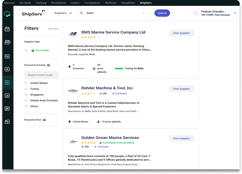 A crew member in an orange suit approaches a large cargo ship while others climb the side of the vessel.