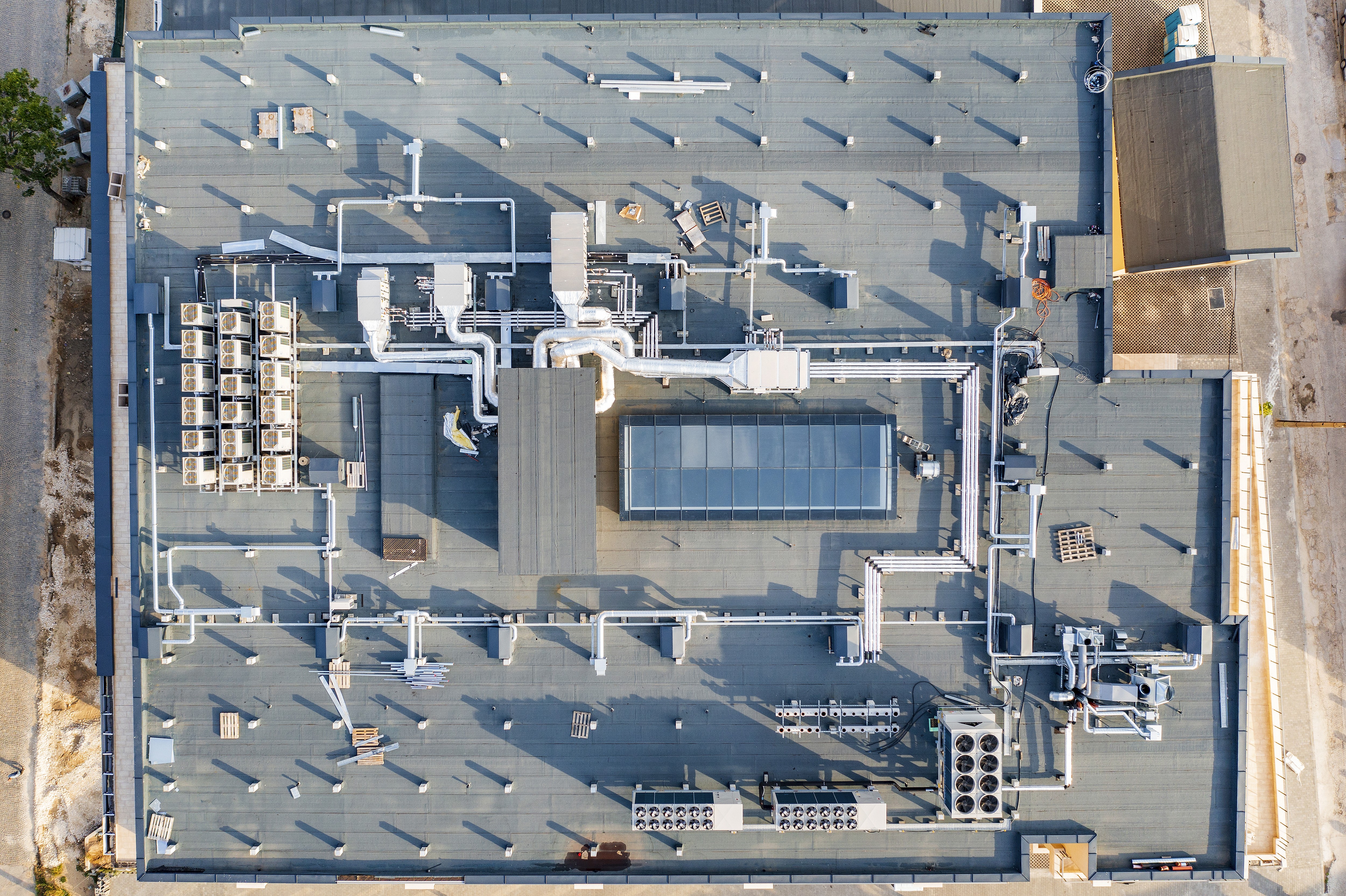 the roof of a building with a lot of solar panels on it