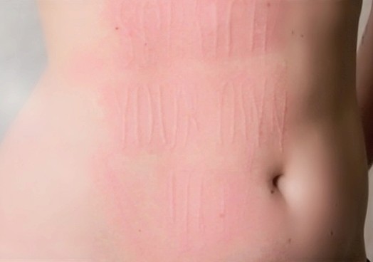 scratch your own itch word scratched on a persons skin