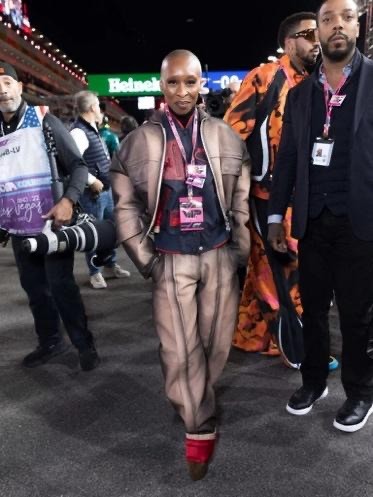 Cynthia Erivo, Las Vegas Grand Prix red carpet, Diesel Fall 2025, Ferrari Spring 2026, Wicked: For Good, Lewis Hamilton, Louboutin Dolly Booty Alta, Atlassian Williams Racing garage