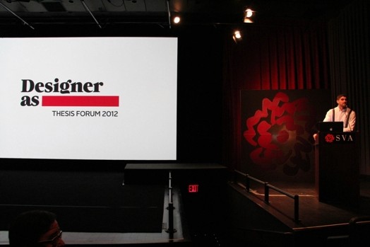 a man giving a speech from a stand in the designer as thesis presentation