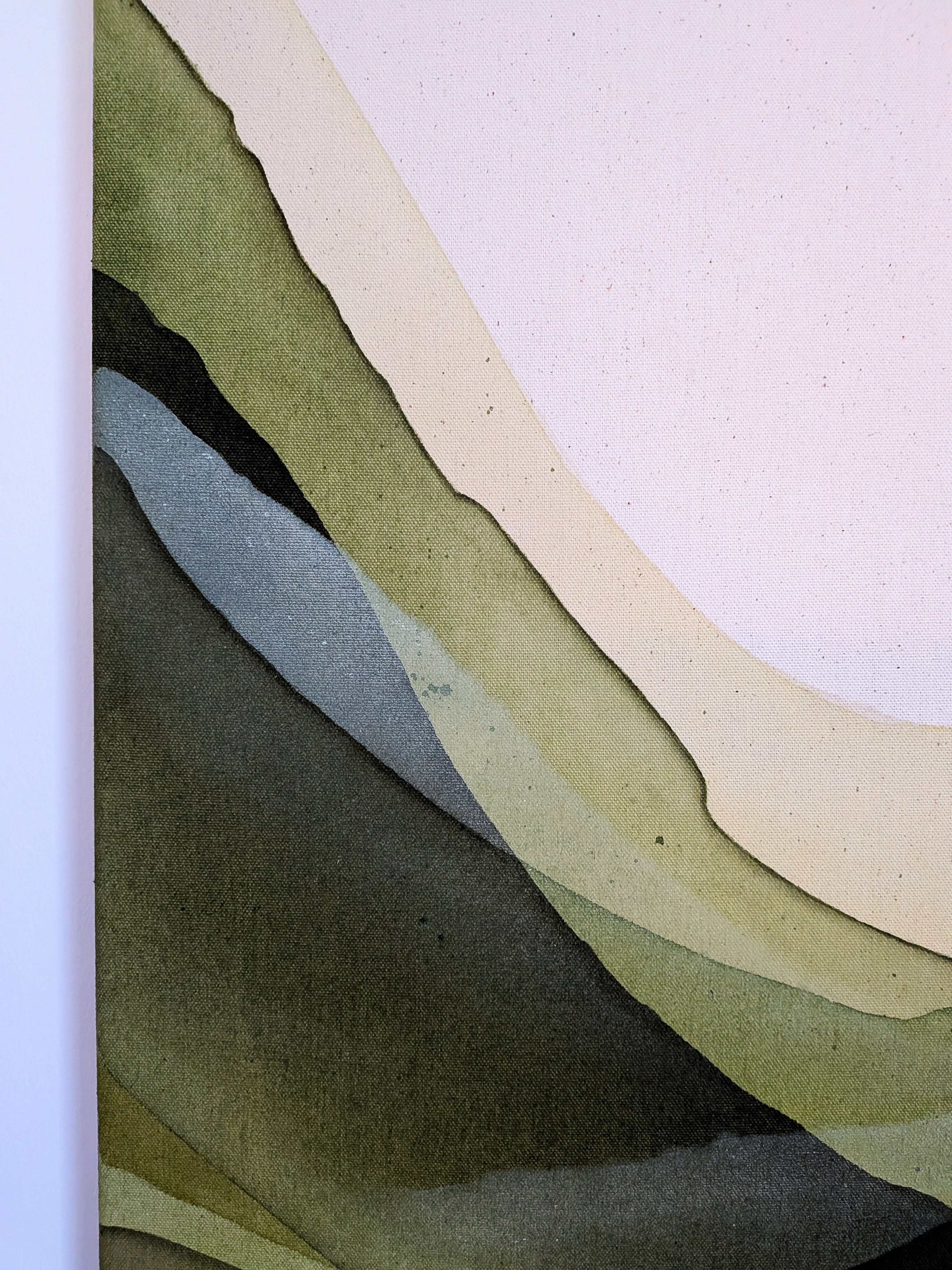 Abstract image featuring layers of soft fabric in pastel colors, including pale pink and muted green.