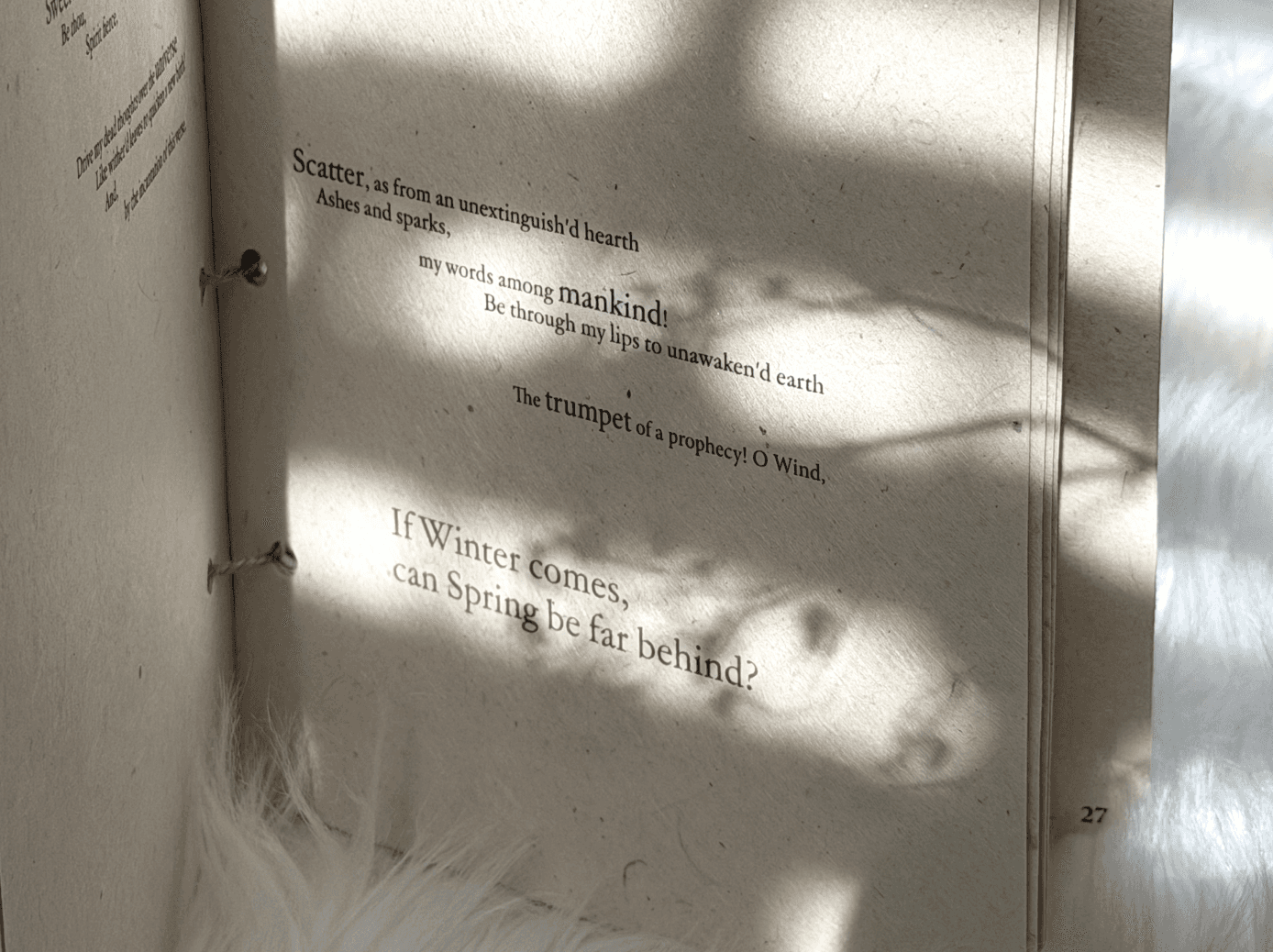 a black cellphone with a white letter on it