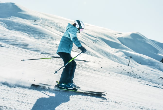 skier goes down the slopes