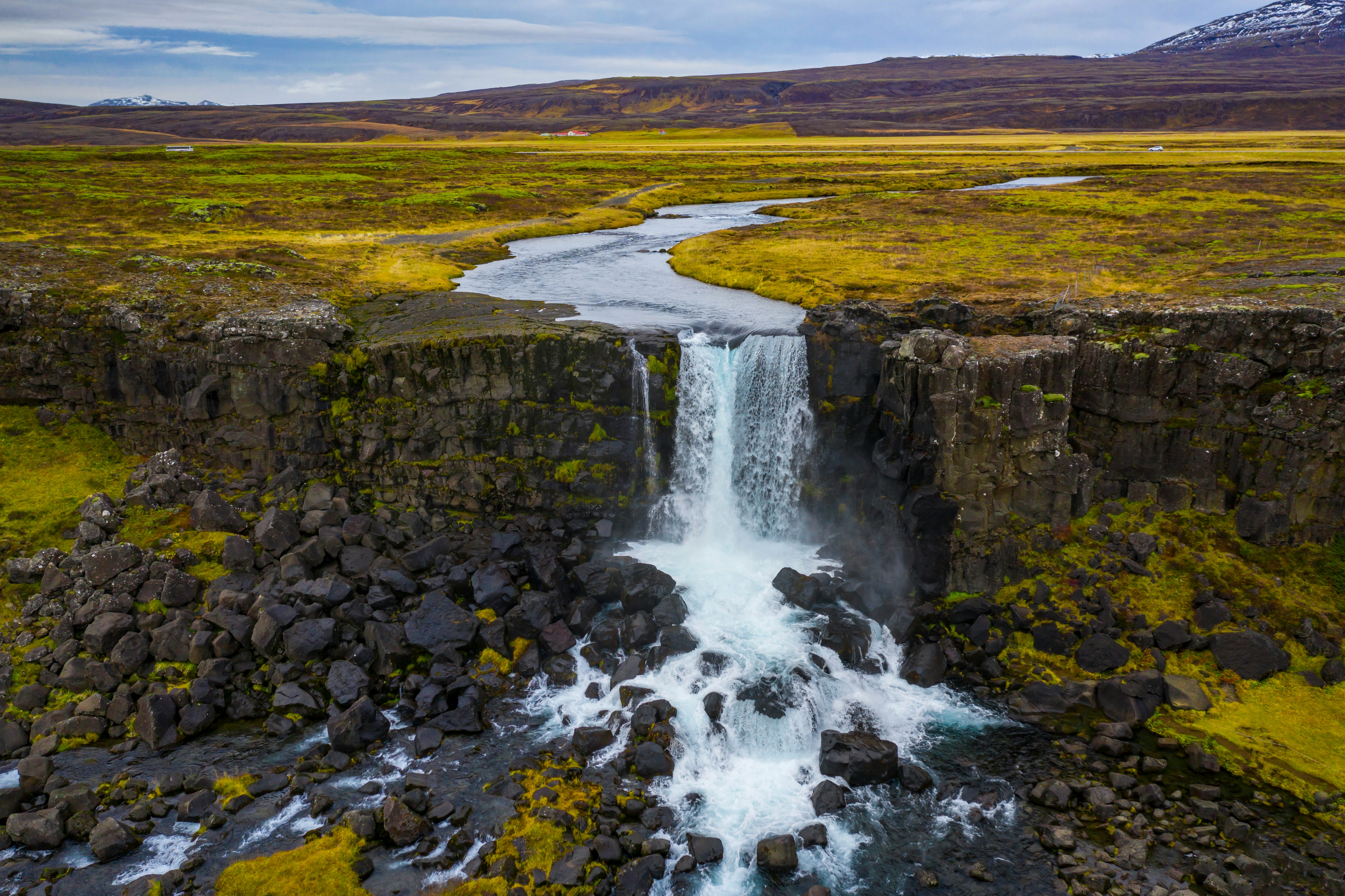 Water cascading down Öxarárfoss Waterfall in Þingvellir National Park.