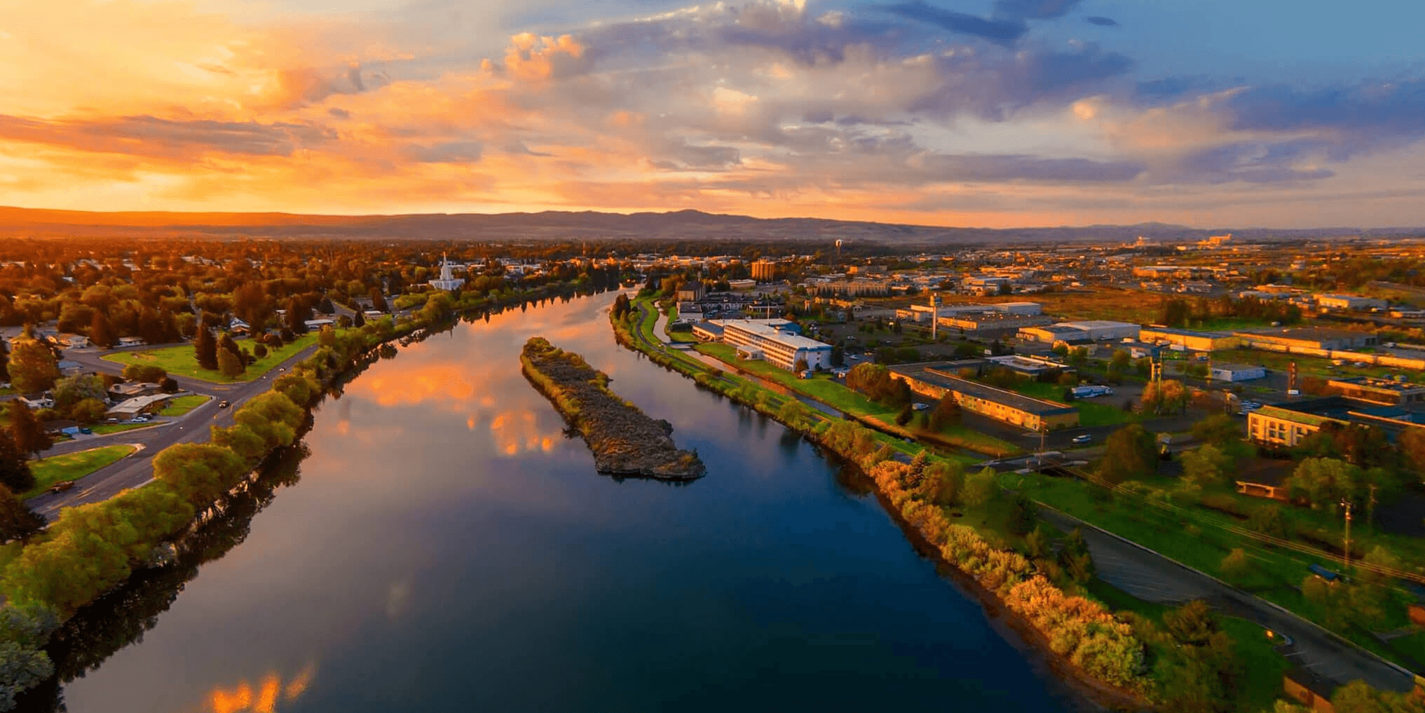 Town with river at sunset