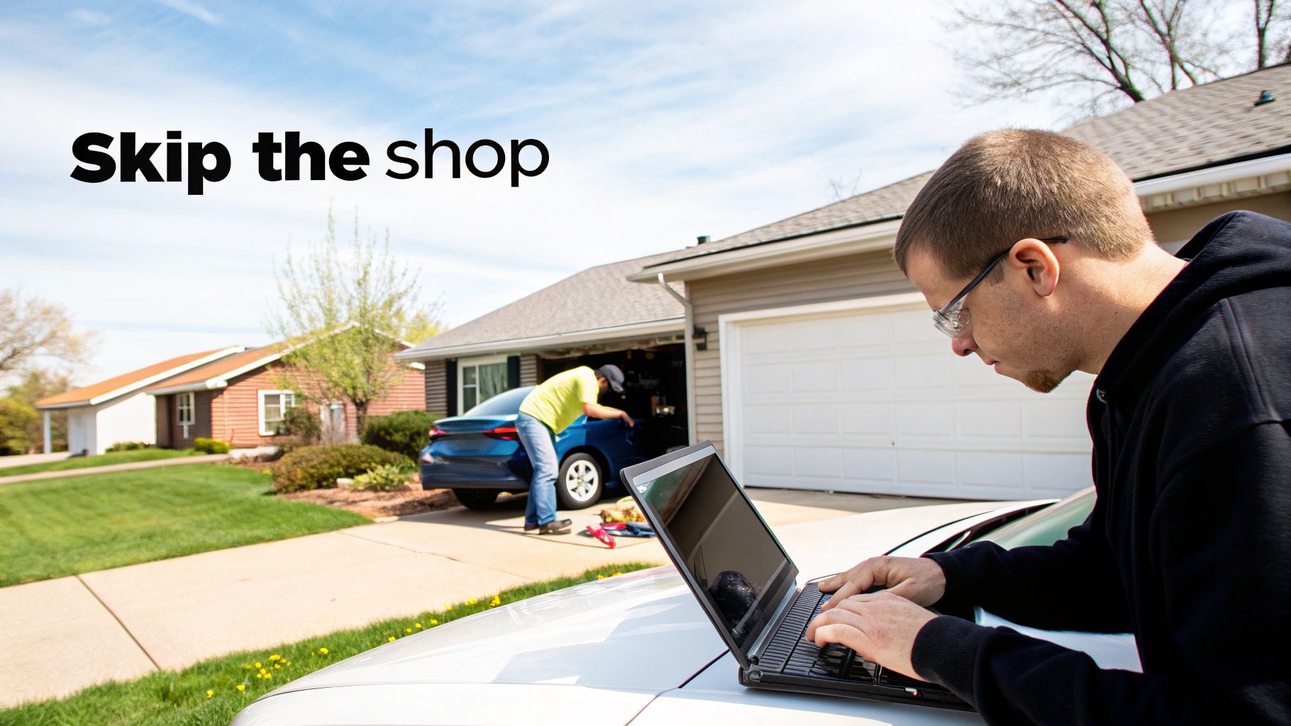 Technician from Auto Renu Auto Glass LLC working on a windshield in a customer's driveway.