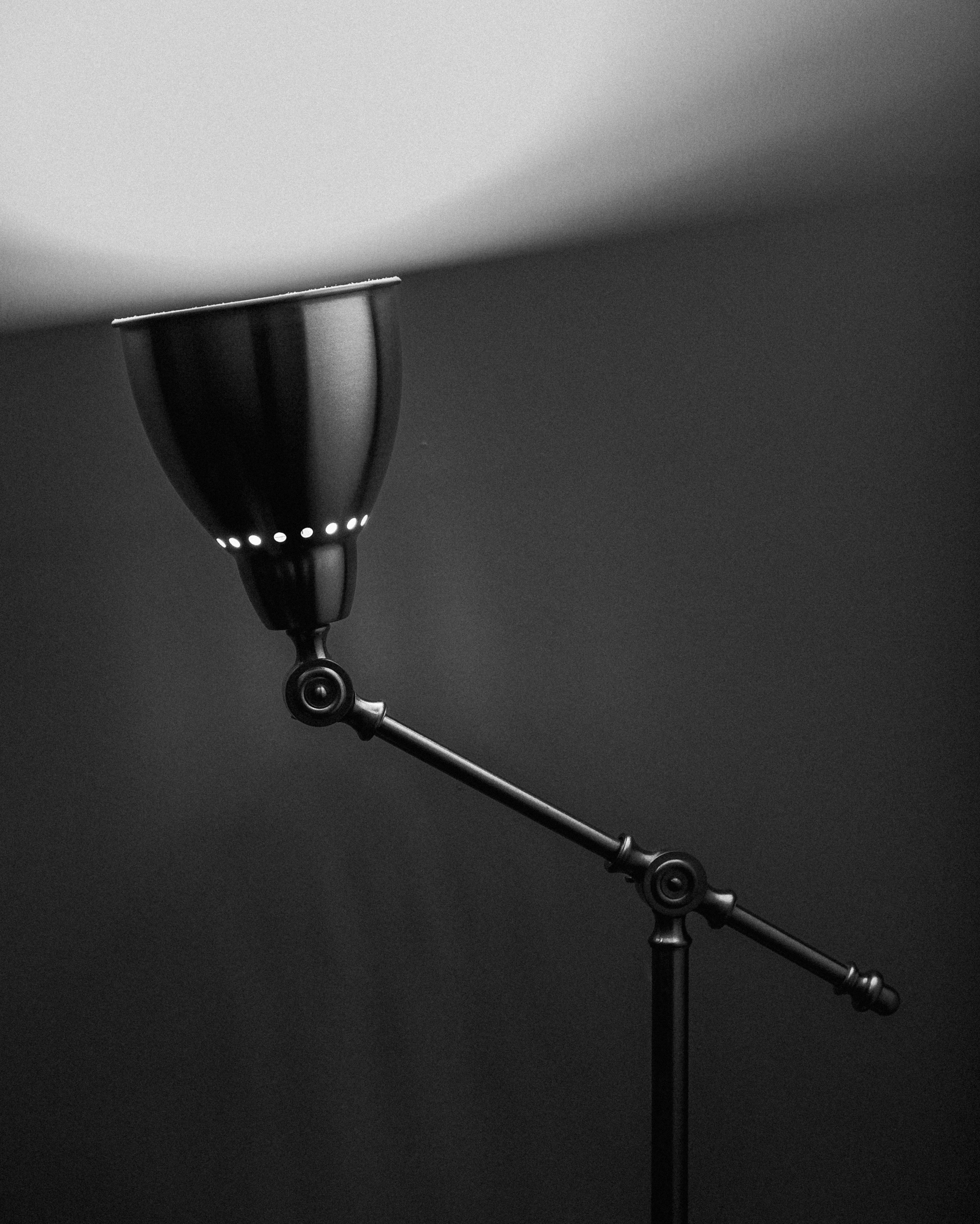 a black and white photo of a lamp