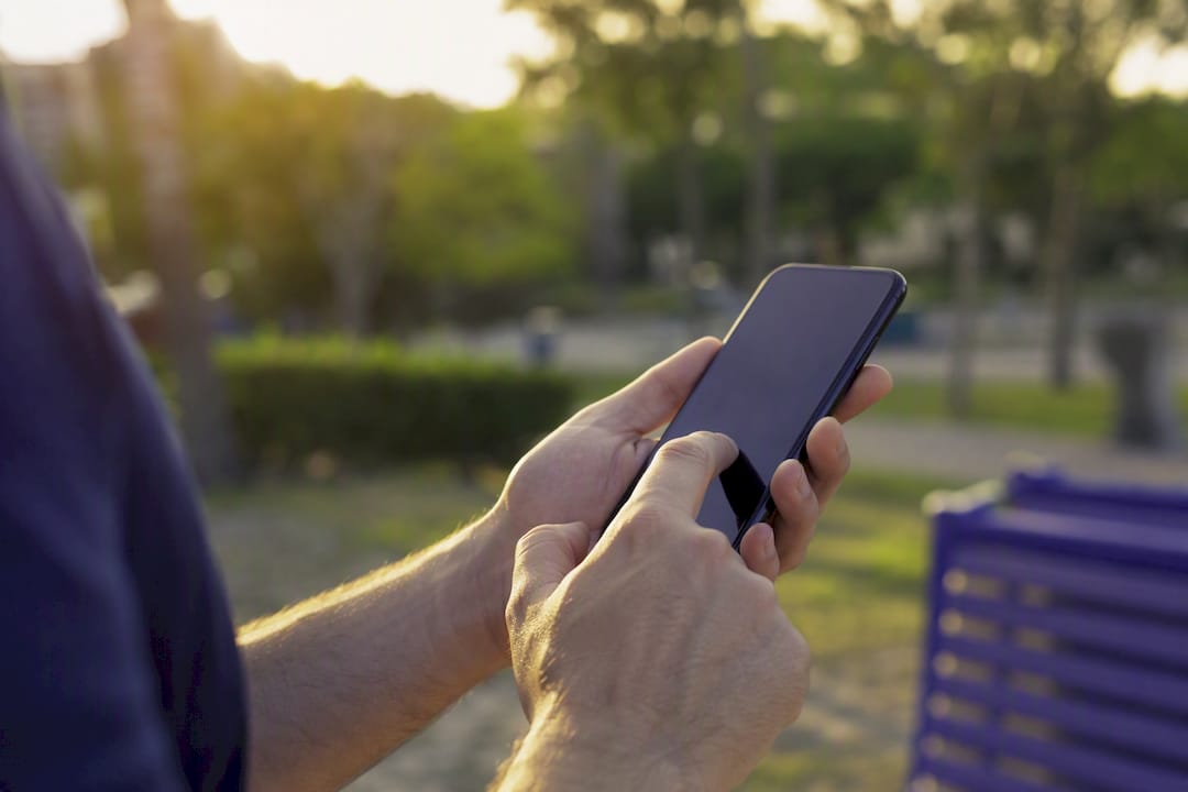 Hands making repeated phone call attempts