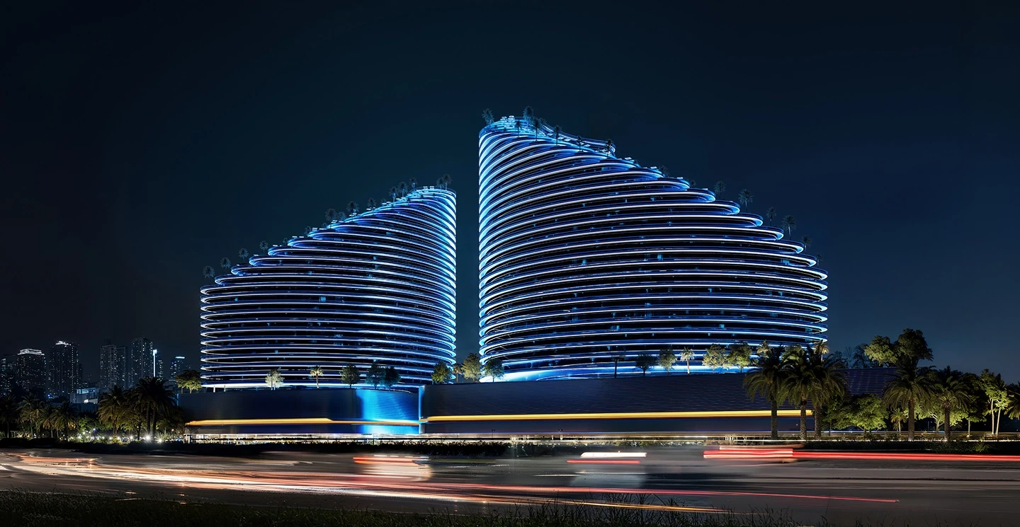 Luxury Dubai property by trusted real estate agent, showing Binghatti Skyflame towers illuminated at night.