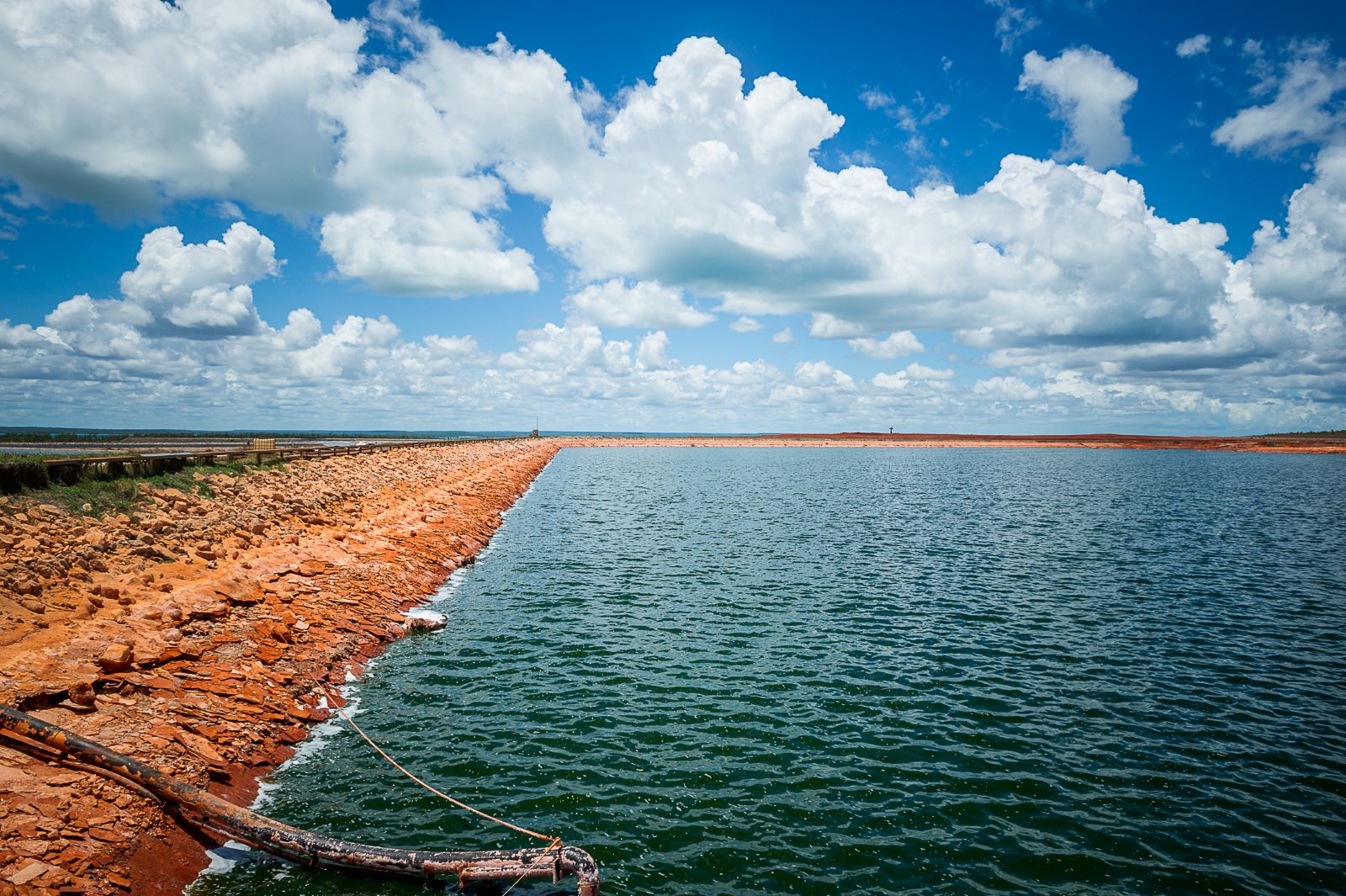Engineered water storage and embankment infrastructure at a mining operation, reflecting UMINEX expertise in environmental management and risk mitigation