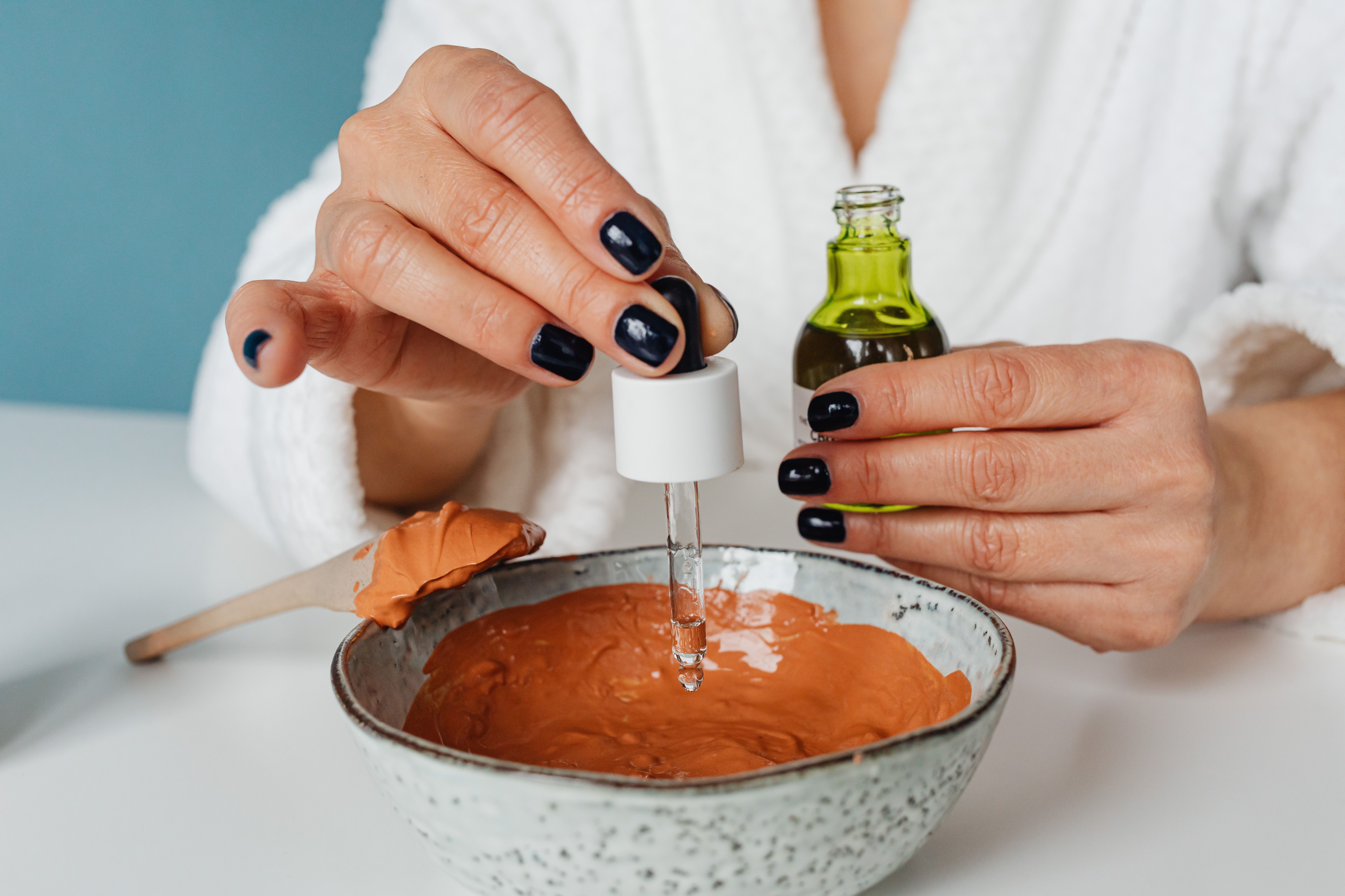 woman mixing a hand cream solution