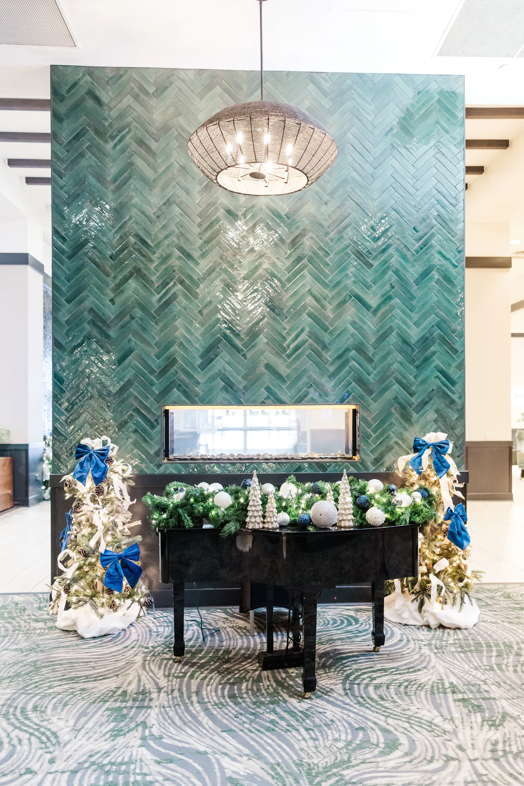 Luxury table setting by Sarah Overall Events with pink embroidered napkins, gold-rimmed plates, floral arrangements, and personalized menus in Shreveport.