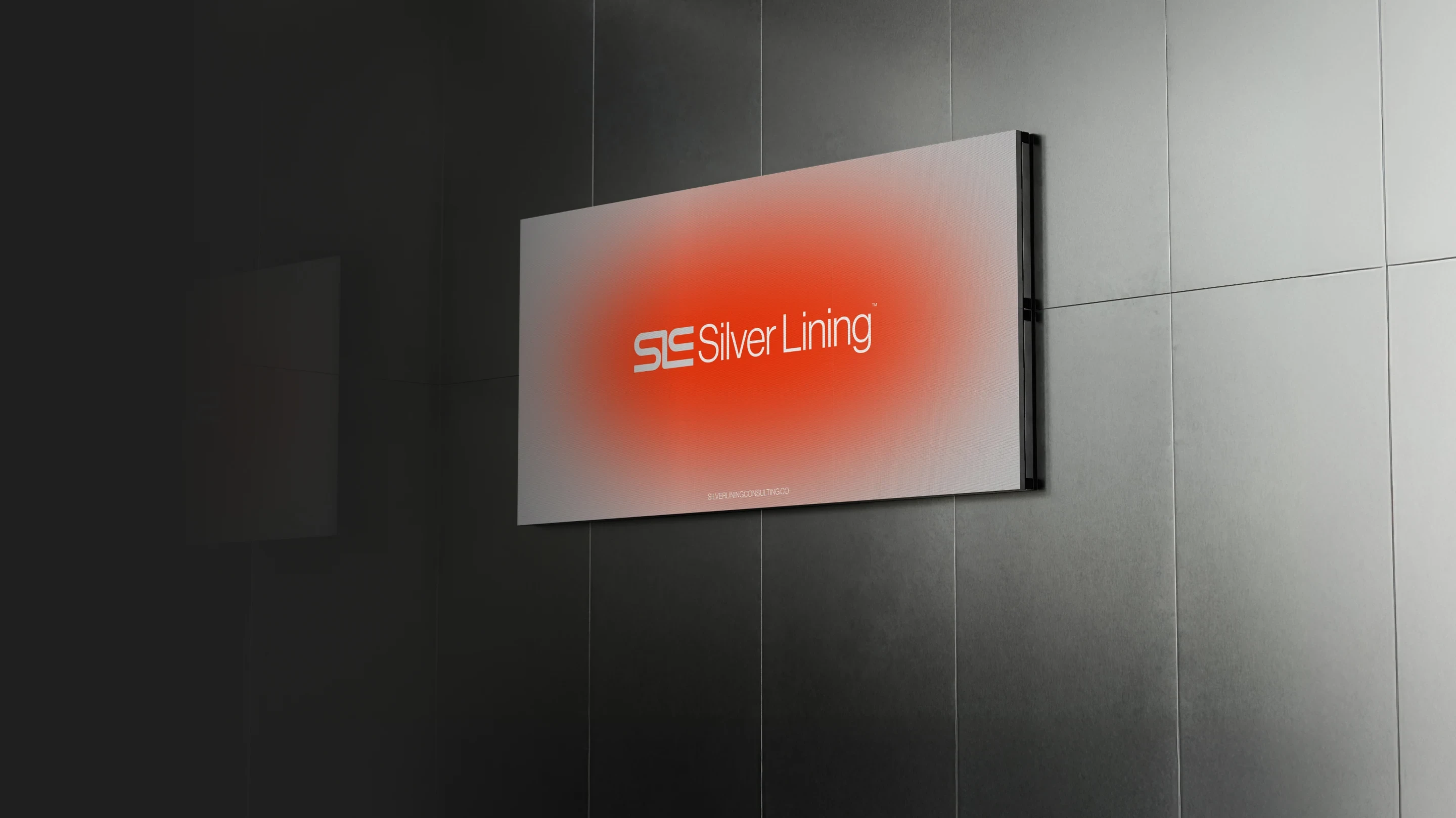 Silver Lining Consulting — Screen with SLC logo in office — Brand identity