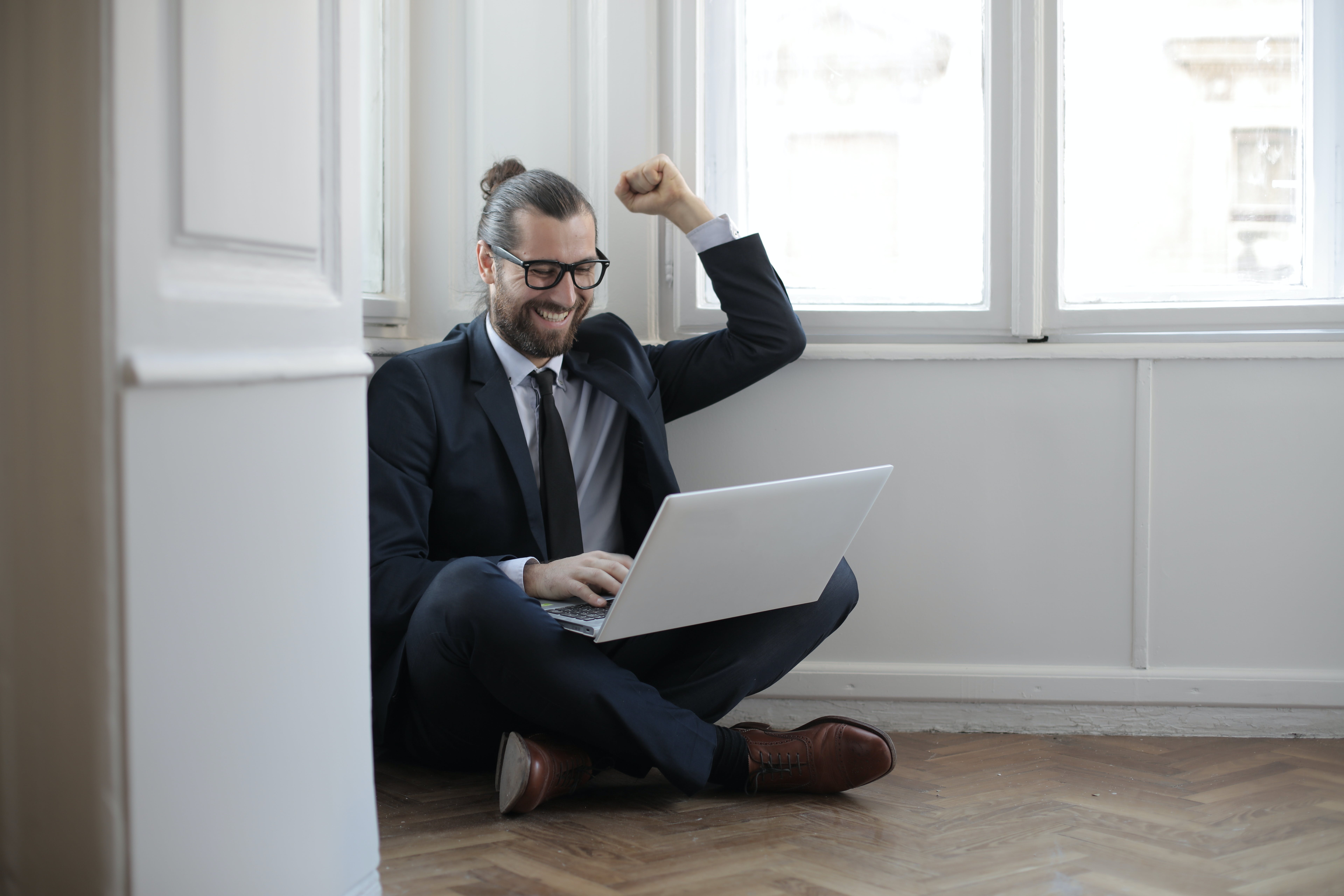 Small business owner happily celebrating after getting cold email responses