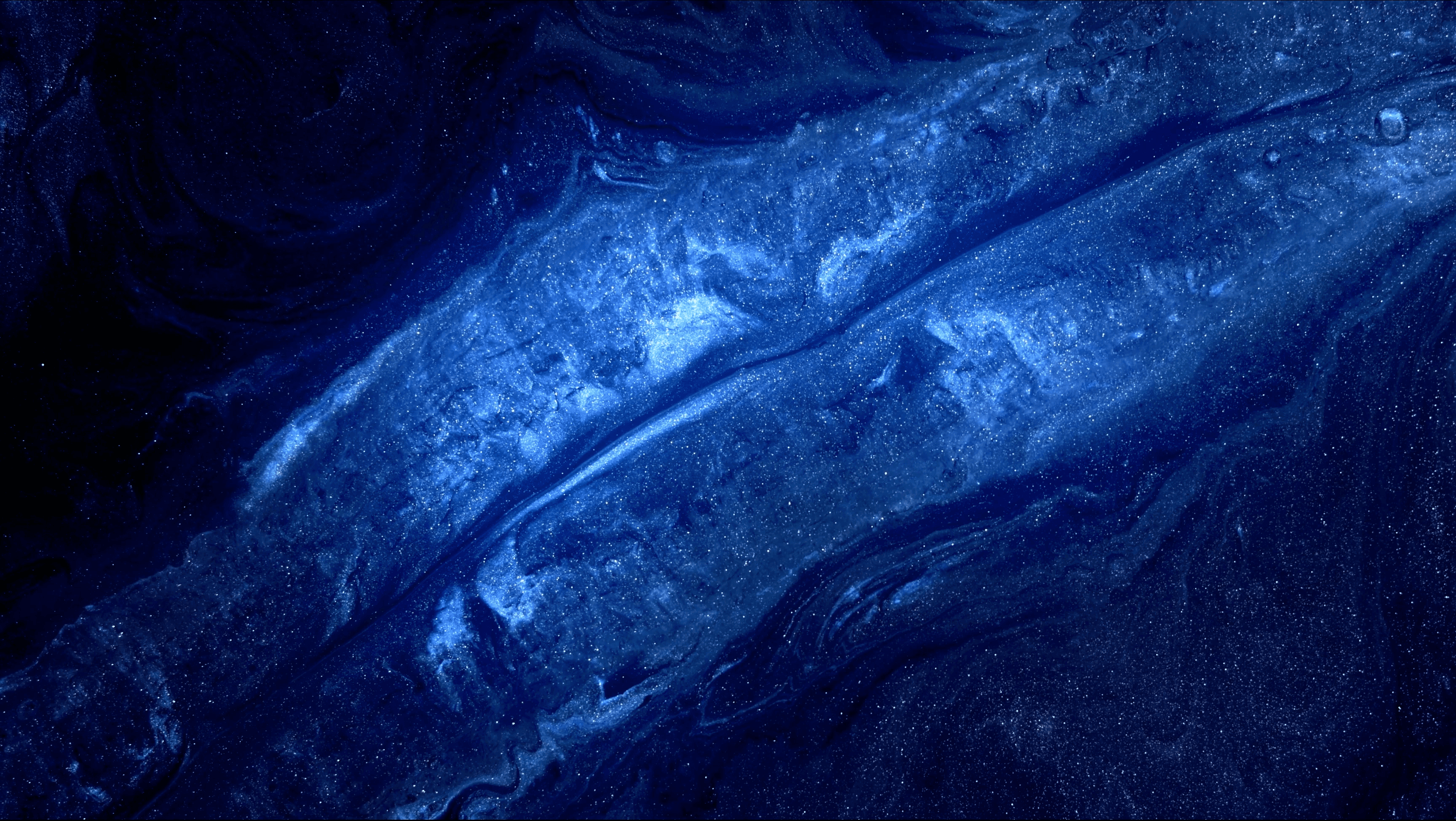  Collaborative work session overhead view of six people collaborating at a rustic wooden table with coffee, papers, and a laptop