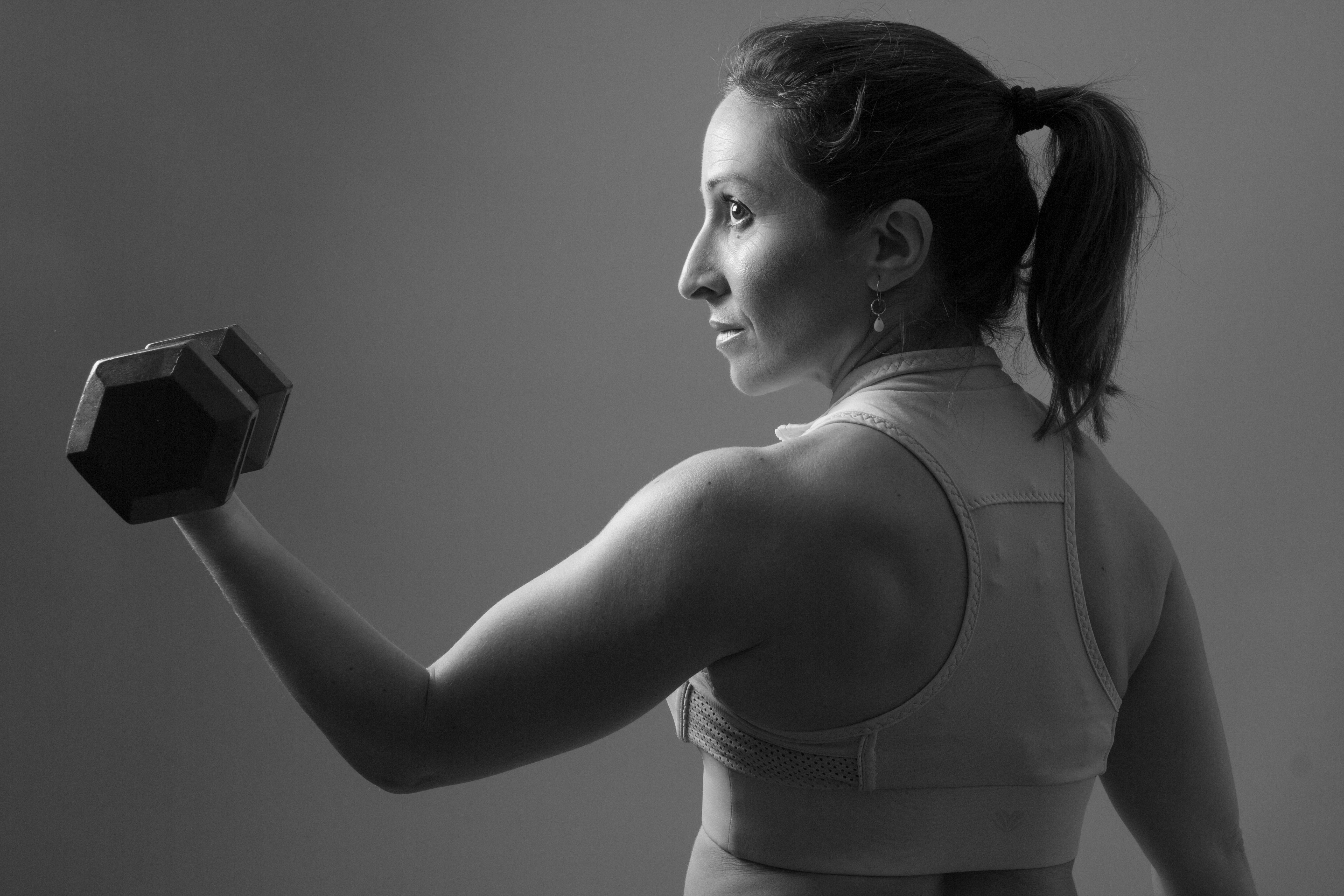 Middle Aged Woman Lifting a Dumbbell