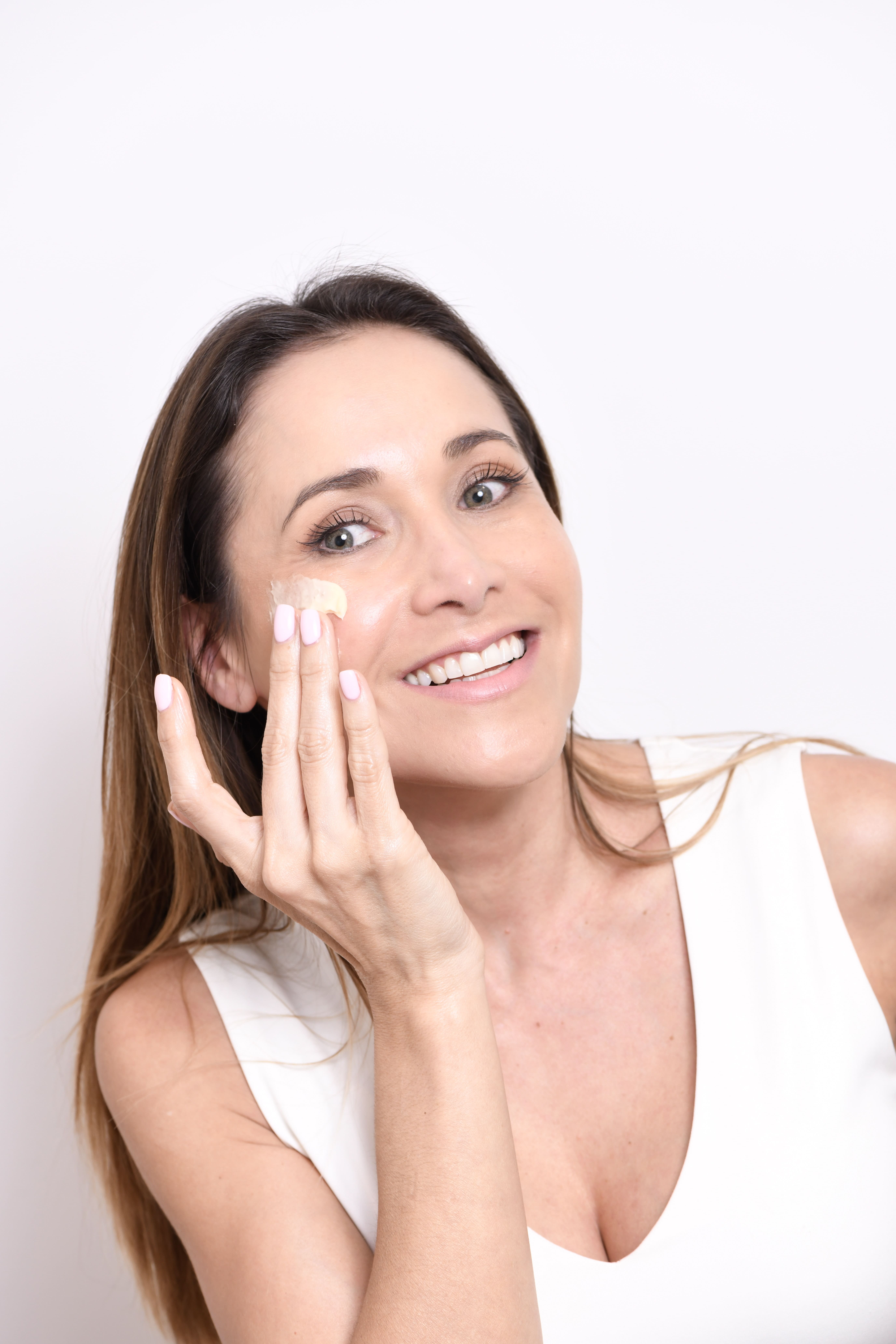 Woman showing her face in the sun