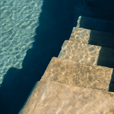 Assortment of ceramic bowls and vases on display.