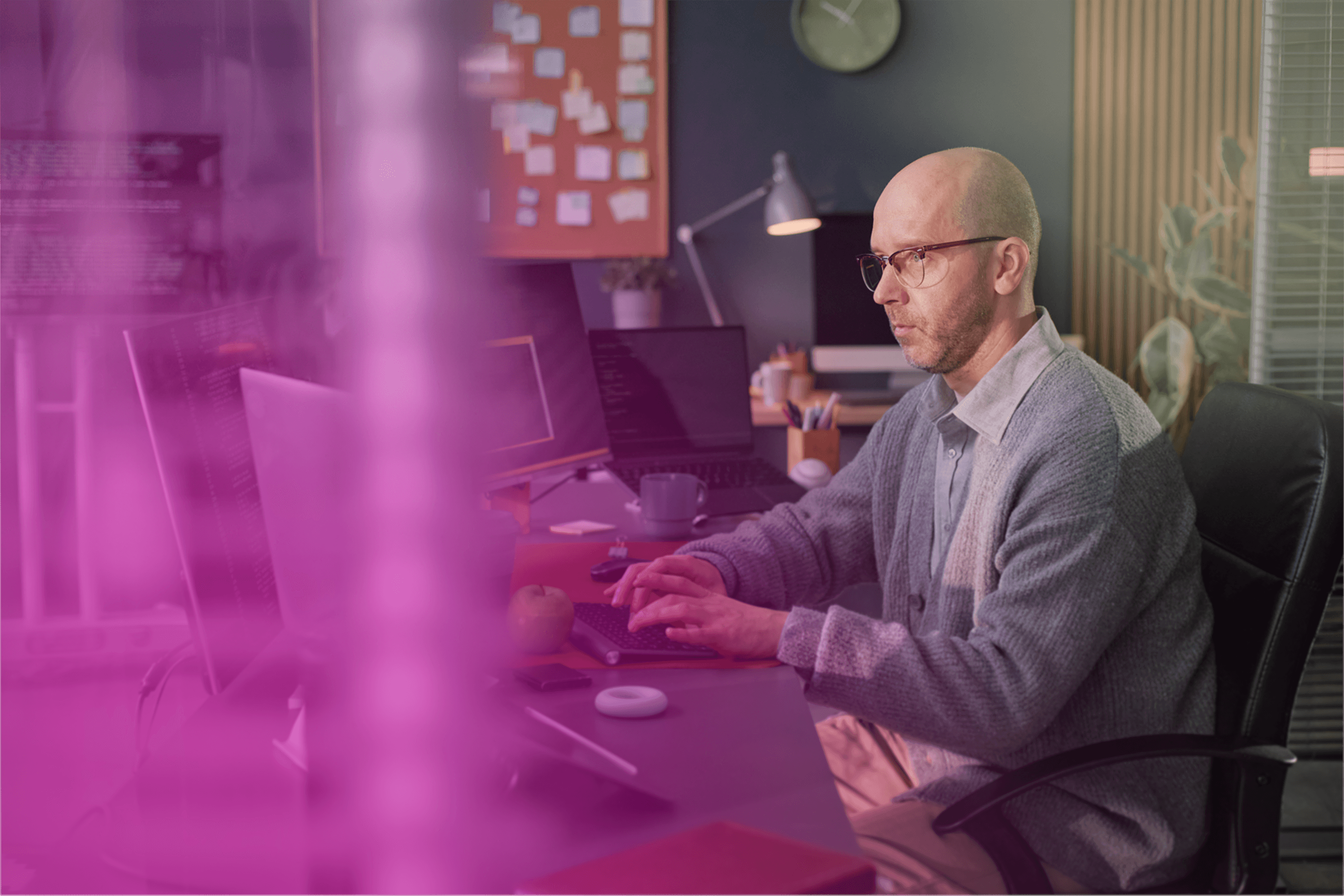 Image featuring a greyscaled website on an abstract background.