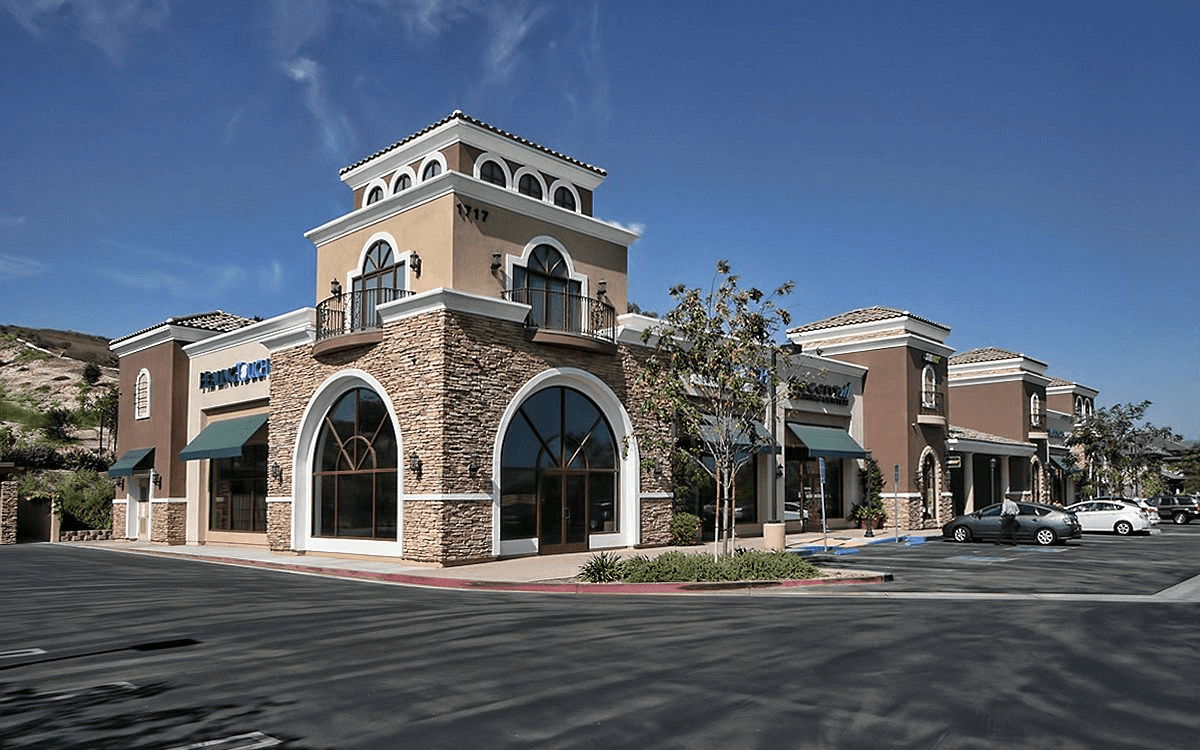 Exterior view of the mall with the parking lot, showcasing the unique design features.