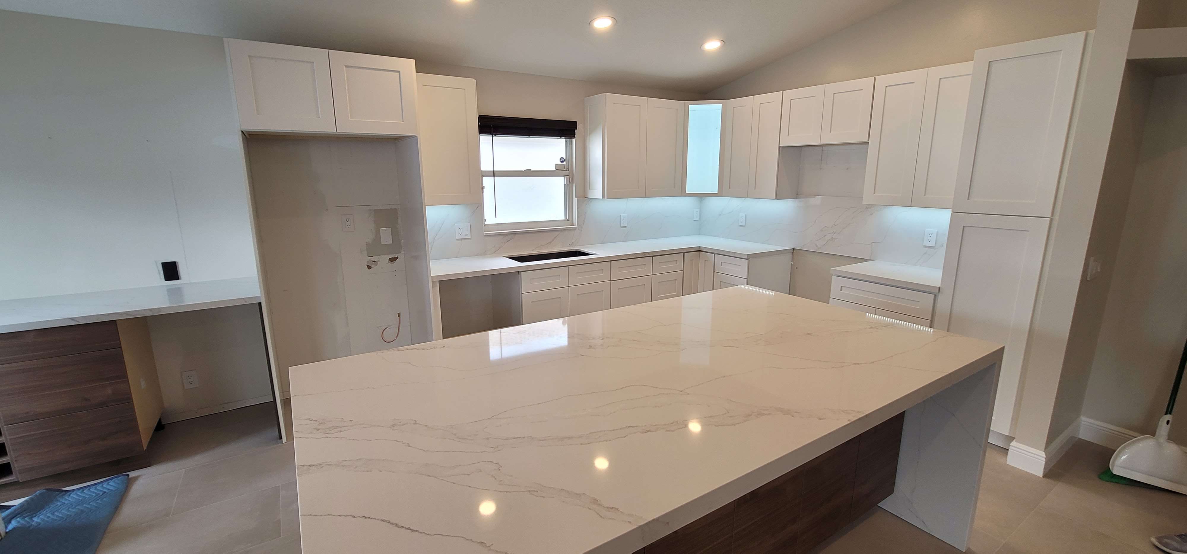 Kitchen recently installed white shaker cabinets and calacatta izaro countertops.