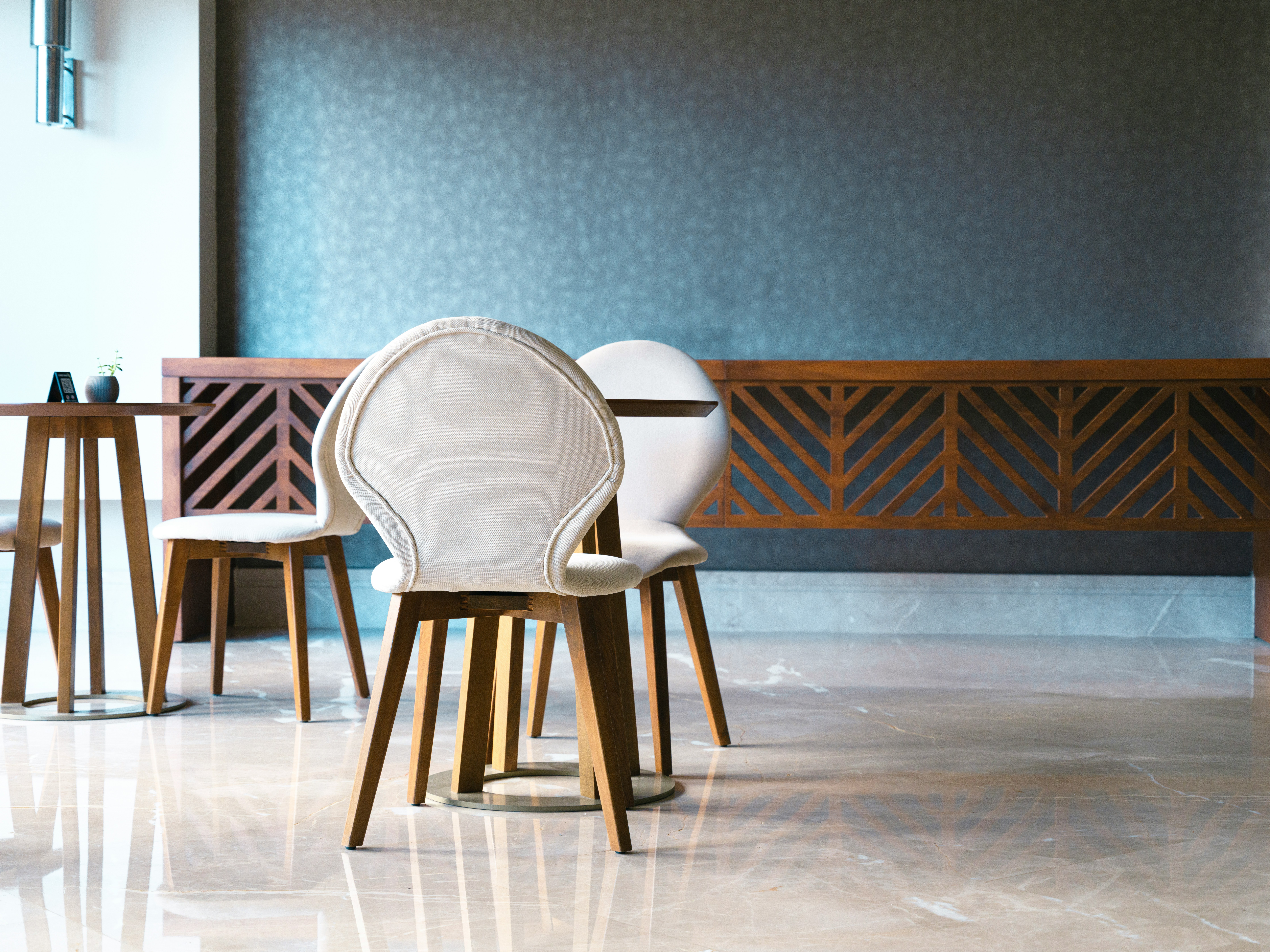 a group of chairs in front of a chalkboard