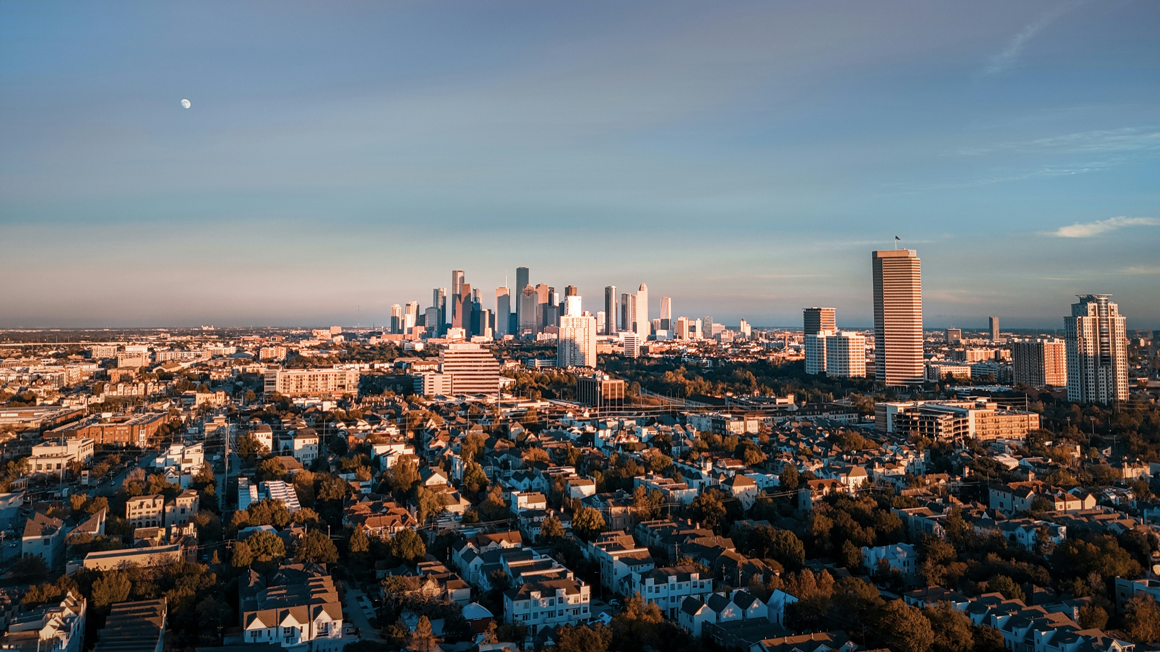 an aerial view of a city with tall buildings