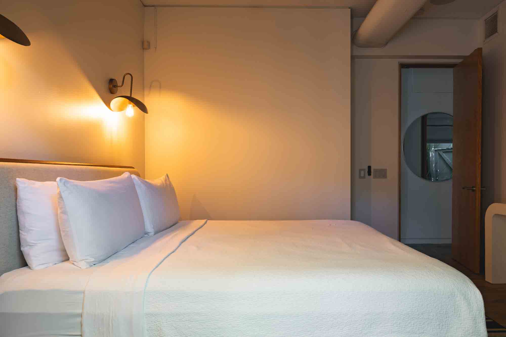 bedroom with minimalist decor, blending style and comfort in contemporary Key West lodging