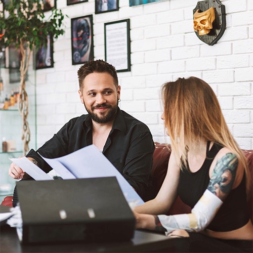 Team members in an office setting having a discussion, representing clear communication throughout the project process.
