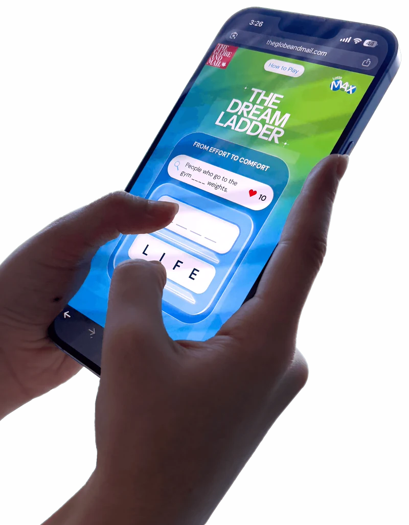 Hand holding a phone playing The Dream Ladder on theglobeandmail.com