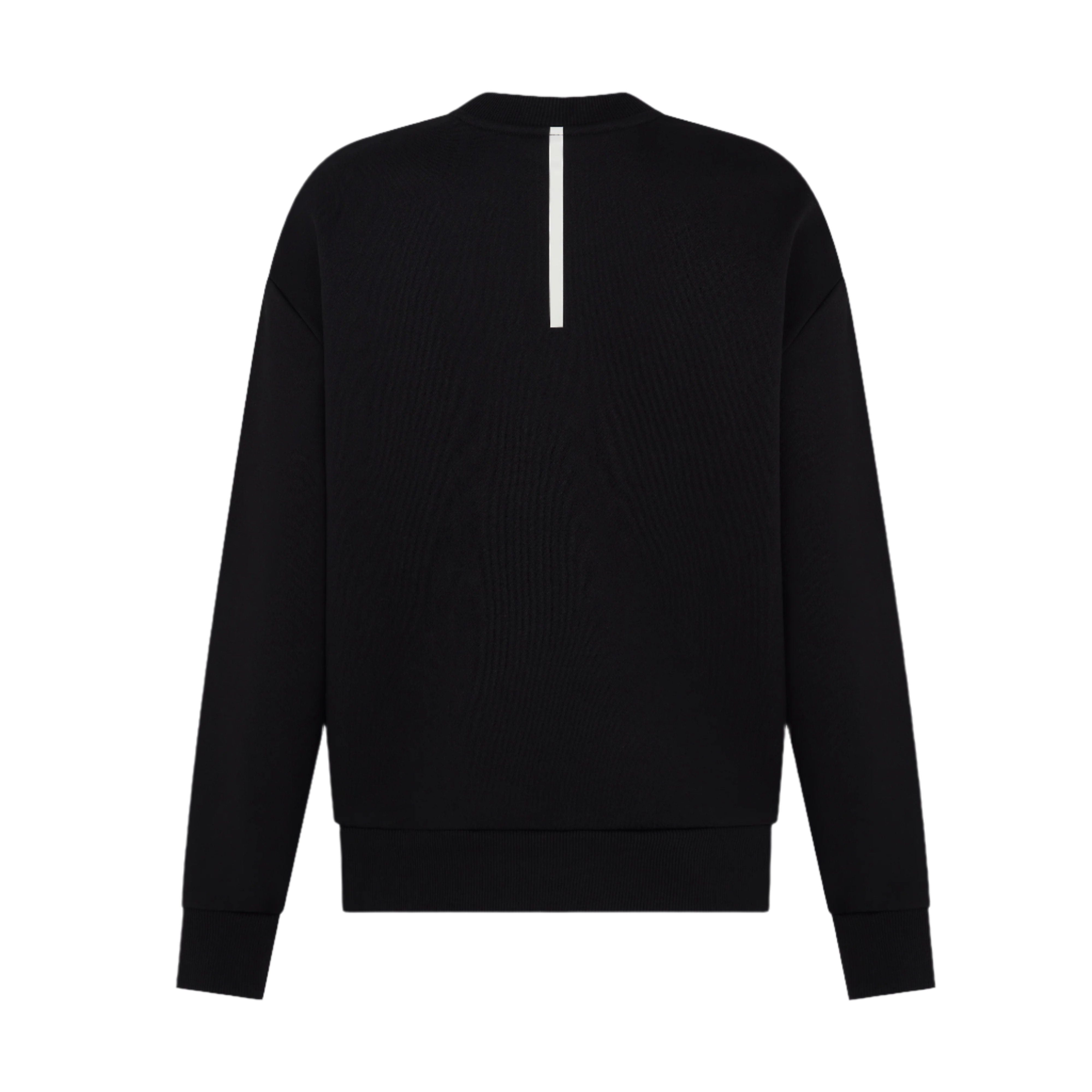 Back-view-of-a-black-crewneck- sweatshirt-with-a-subtle-reflective- vertical-white-stripe-detail-on-the- upper-back-Minimalist-women's- athletic-layering-piece