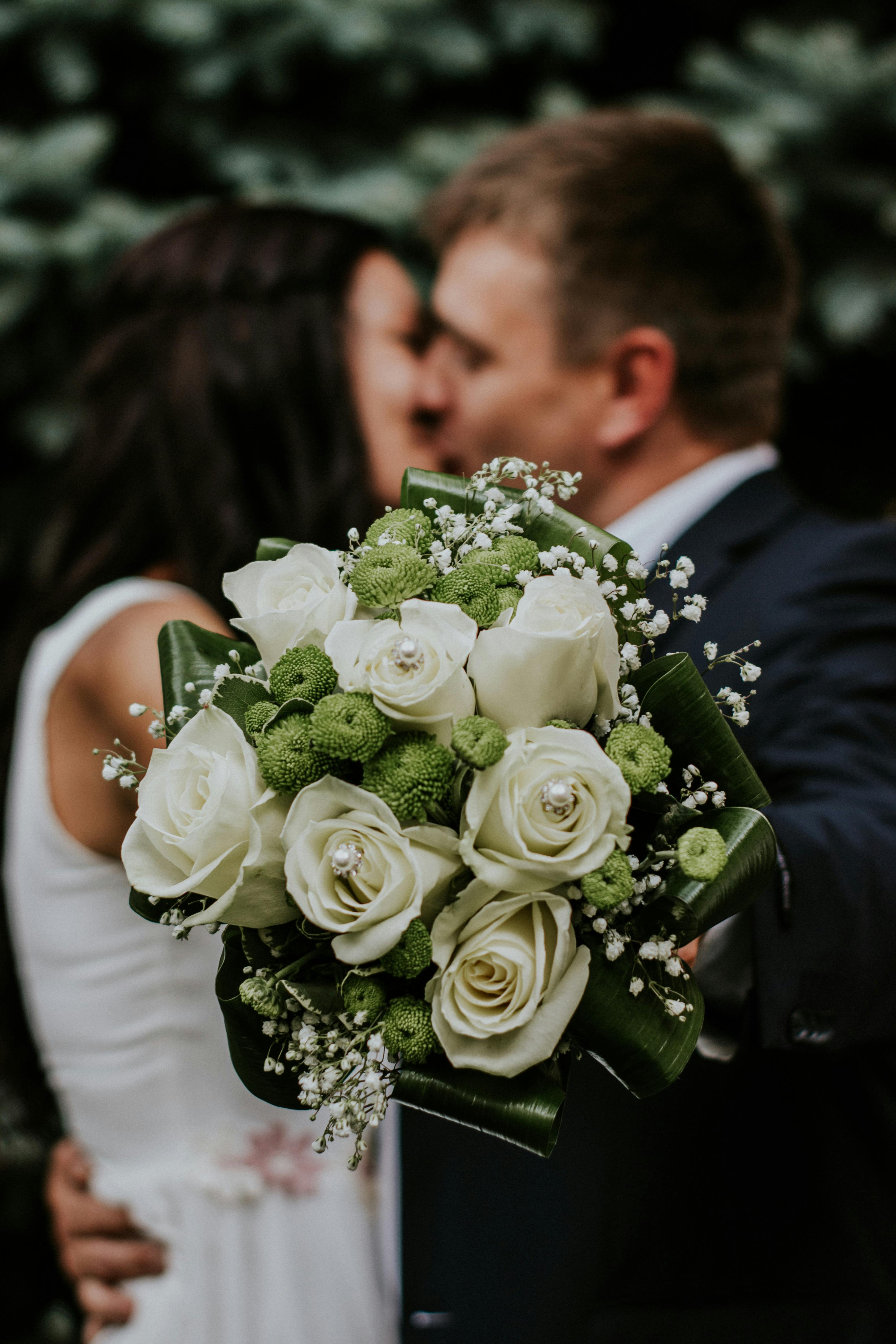 A wedding couple kissing